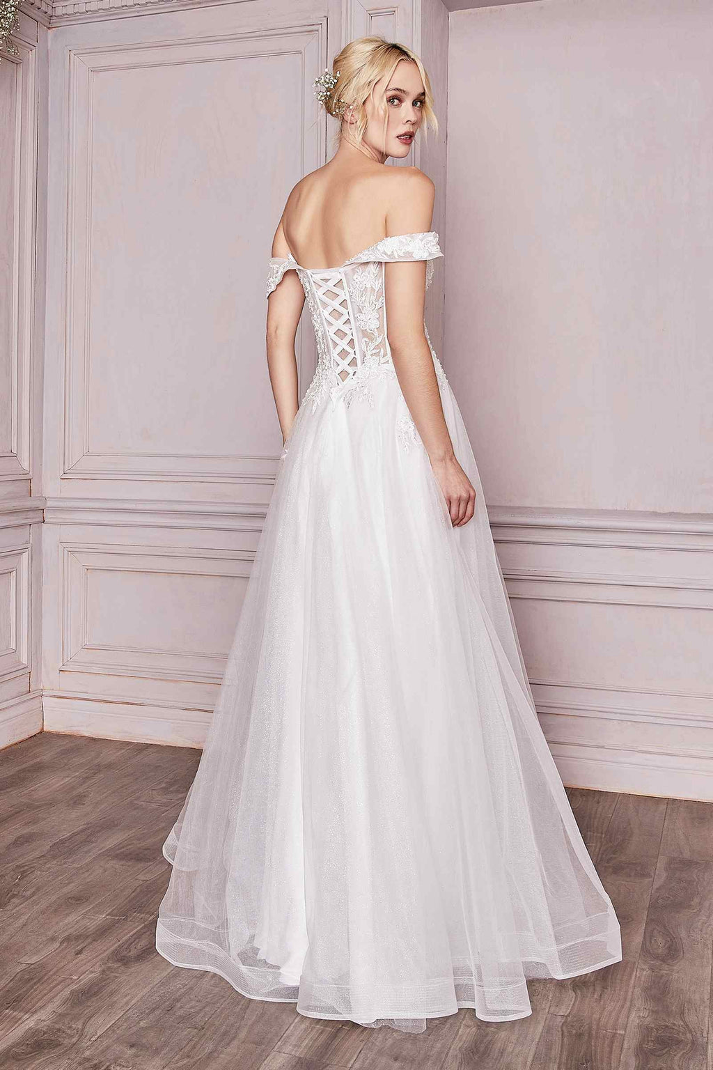 Off-white off-shoulder lace bridal gown with fitted bodice and flowing tulle skirt