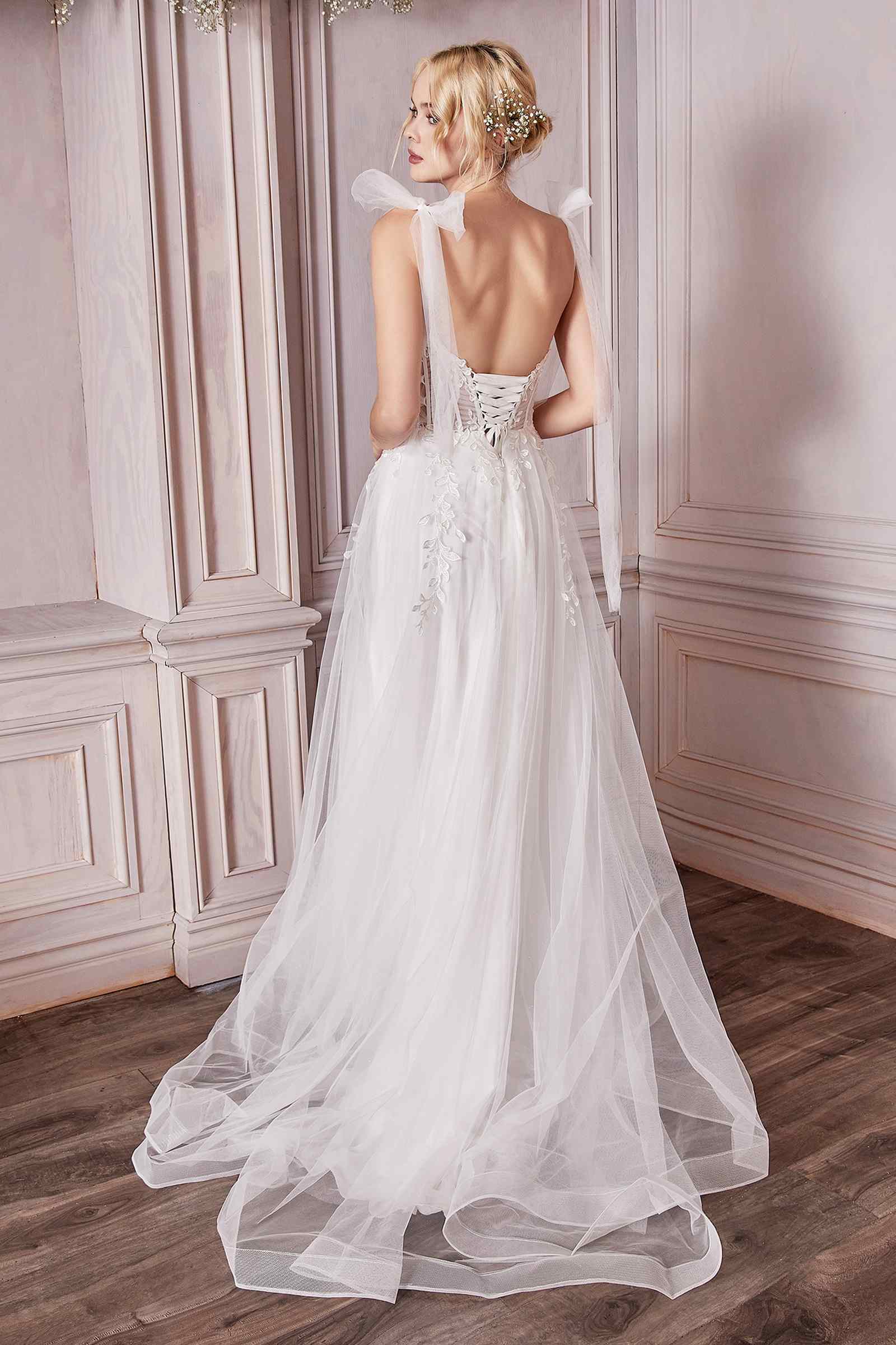 Off-white A-line wedding gown with lace corset bodice and full tulle skirt