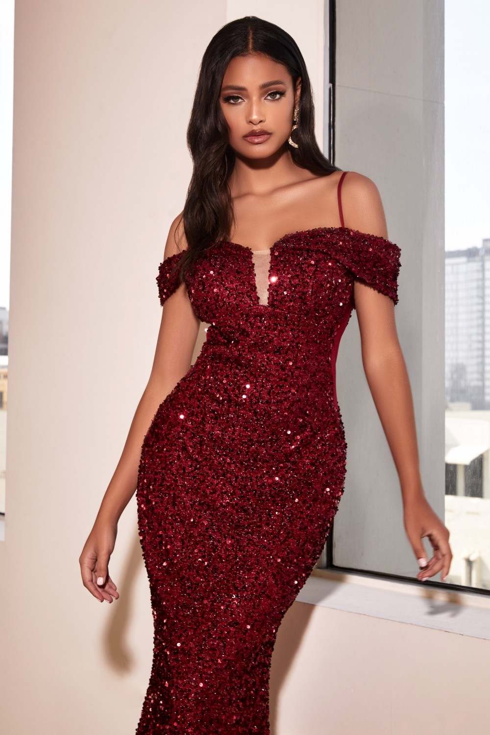 Burgundy sequin mermaid dress with off-shoulder neckline and tapered skirt