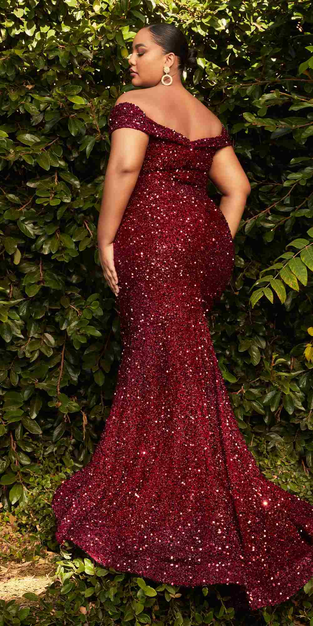 Burgundy sequin mermaid gown with long off-shoulder neckline and flared skirt