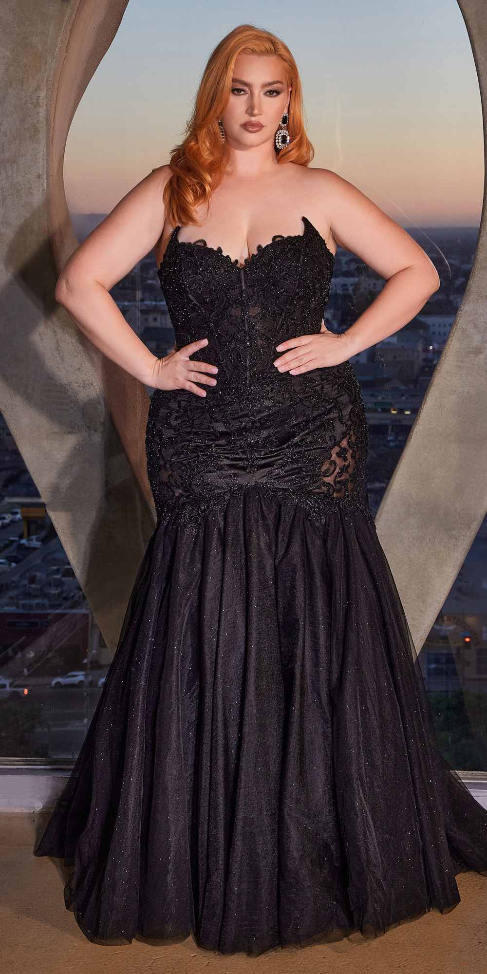 Black strapless lace mermaid gown with fitted corset bodice and flared skirt