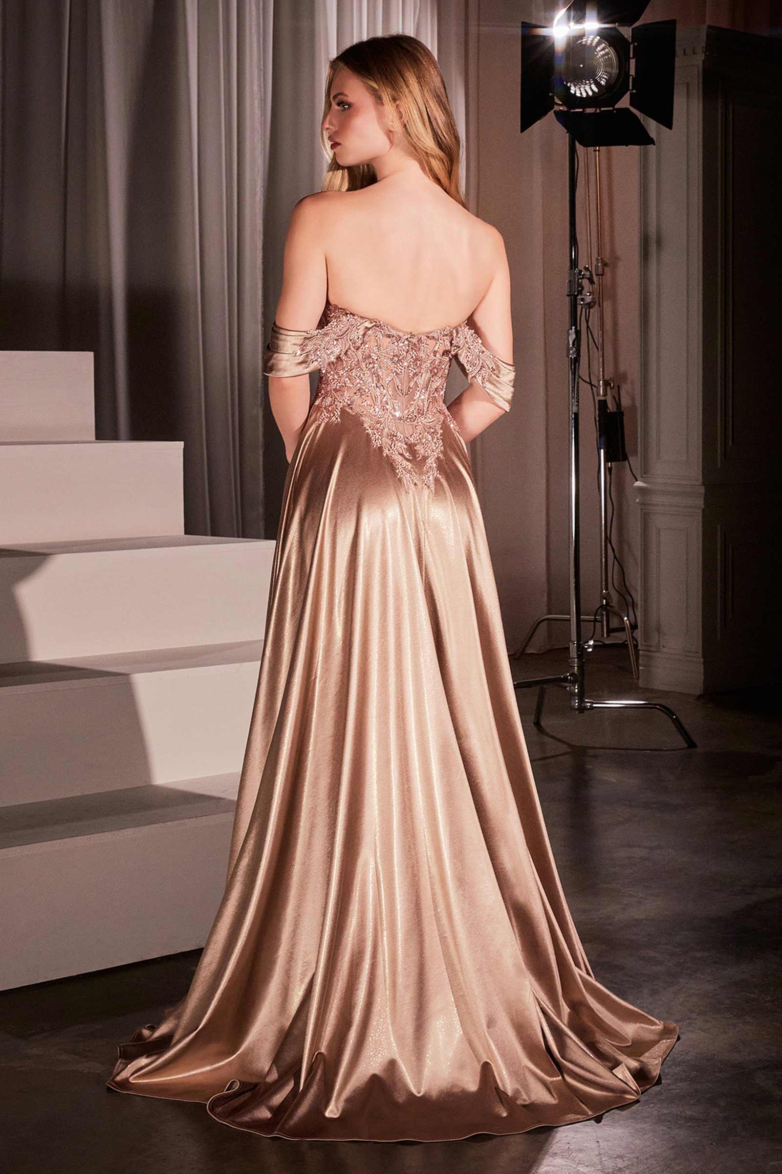 Mocha gold off-shoulder A-line prom gown with lace corset bodice and satin skirt, back view