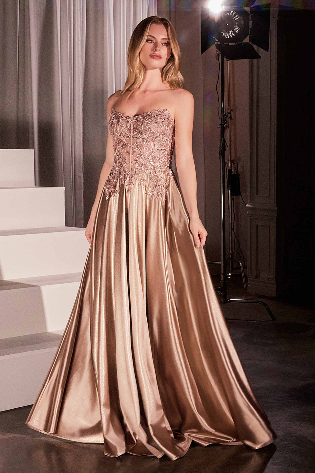 Mocha gold off-shoulder A-line prom gown with lace bodice and flowing satin skirt