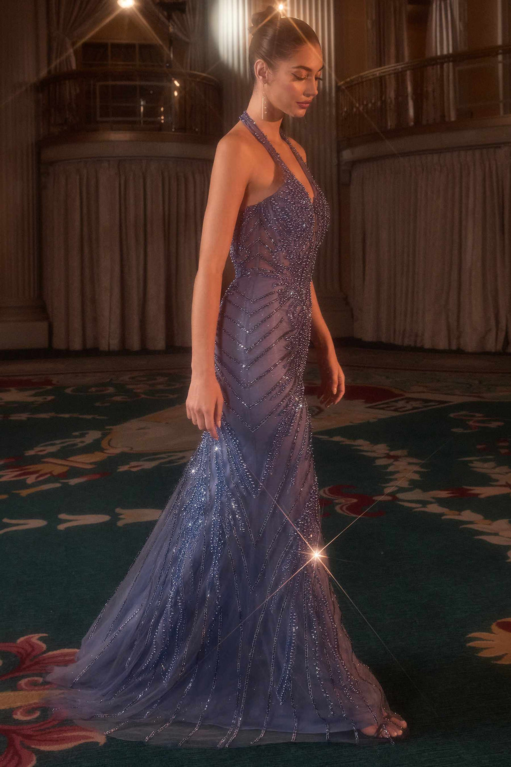 Blue halter fitted evening gown with sleeveless plunging bodice and long mermaid skirt