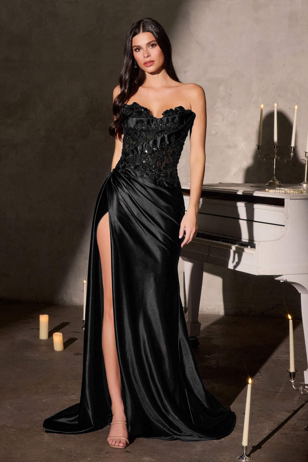 Black strapless satin gown with beaded bodice and thigh-high leg slit
