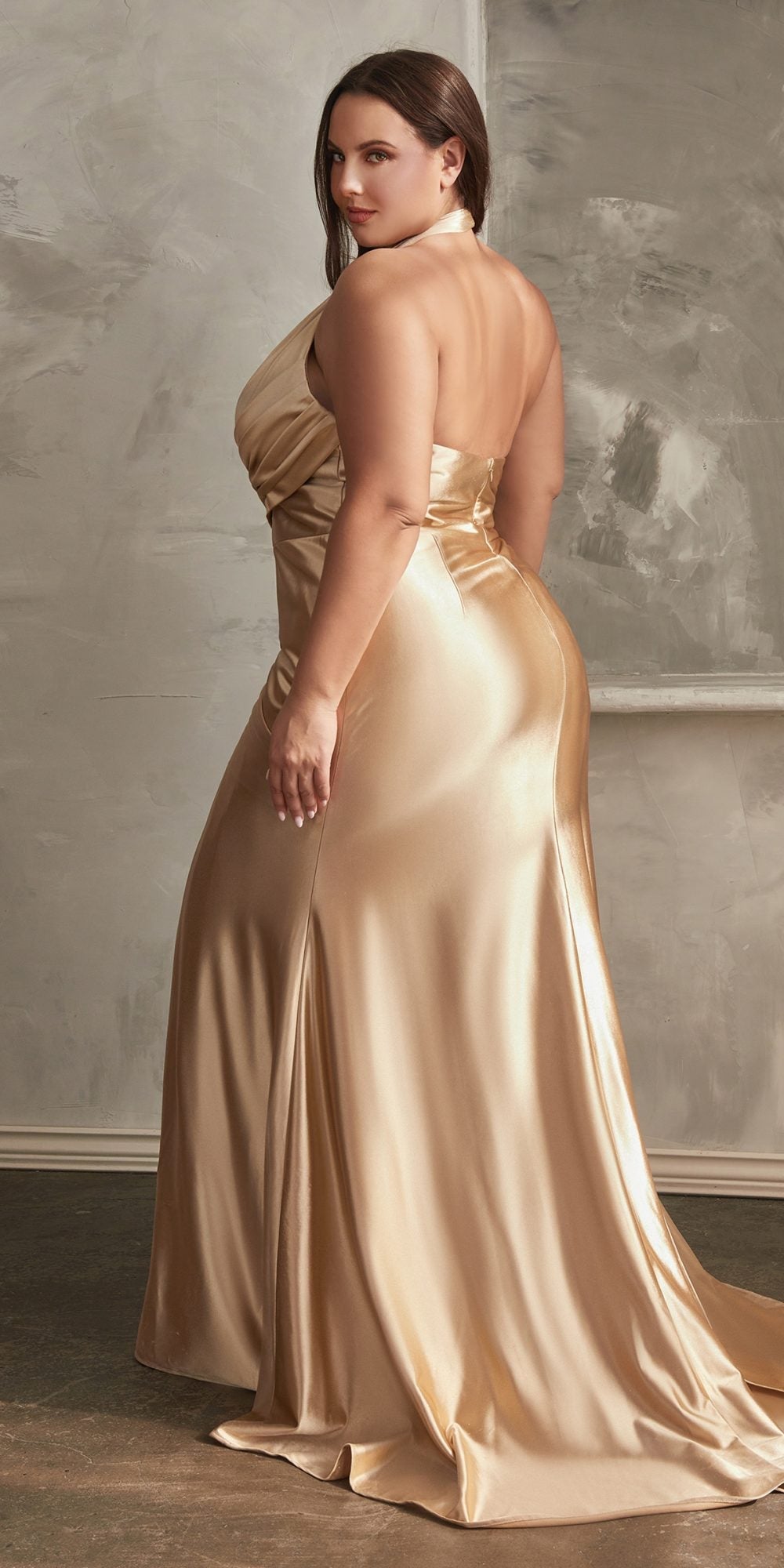 Gold satin halter floor-length fitted gown with side slit and draped waist