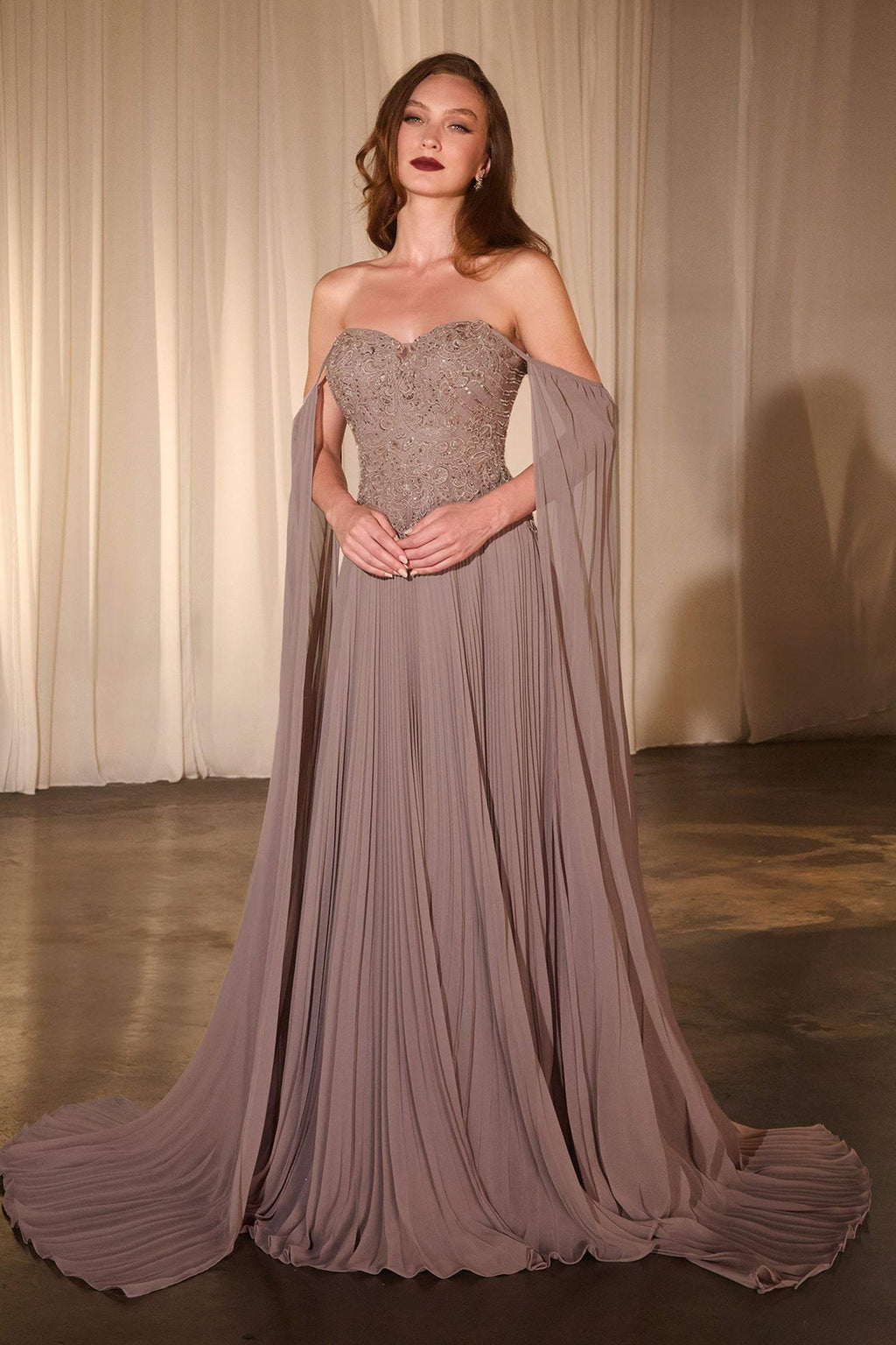 Dusty lavender pleated A-line gown with draped cape sleeves and sparkle sweetheart bodice