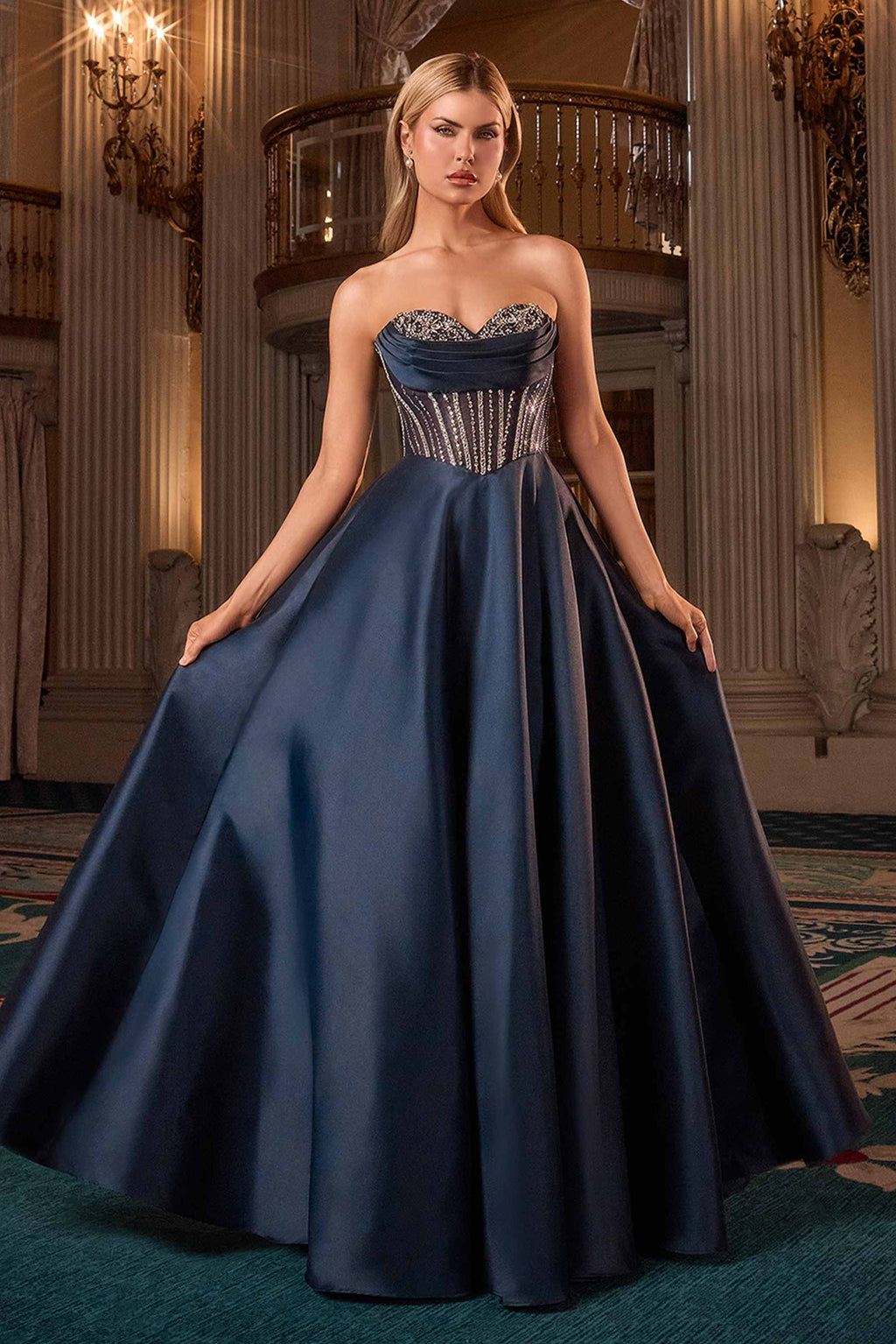 Navy strapless sweetheart ball gown with corset bodice and gathered full skirt