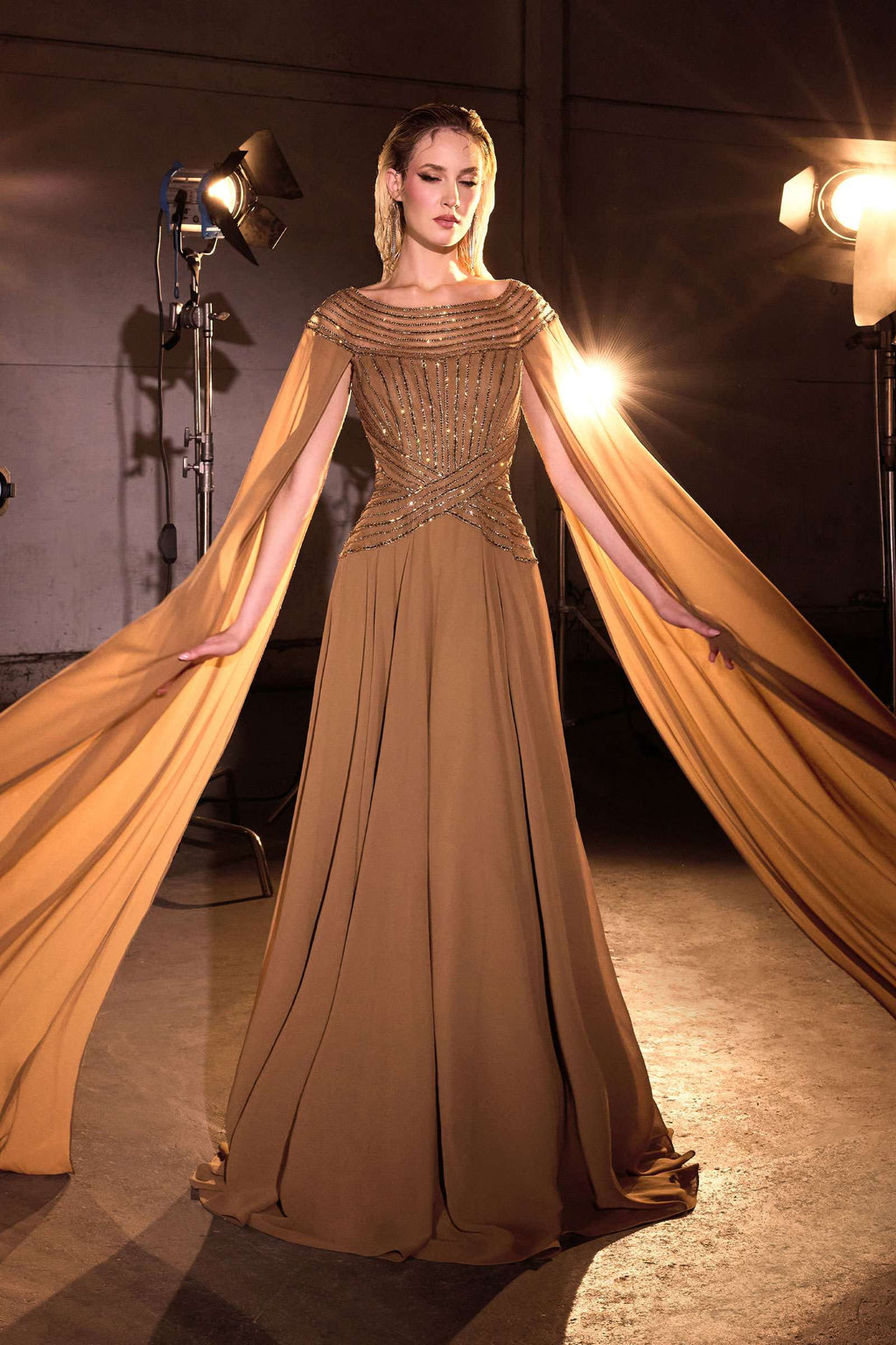 Bronze A-line evening gown with draped chiffon cape and embellished fitted waist