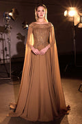 Bronze A-line evening gown with jeweled bodice and flowing chiffon cape sleeves
