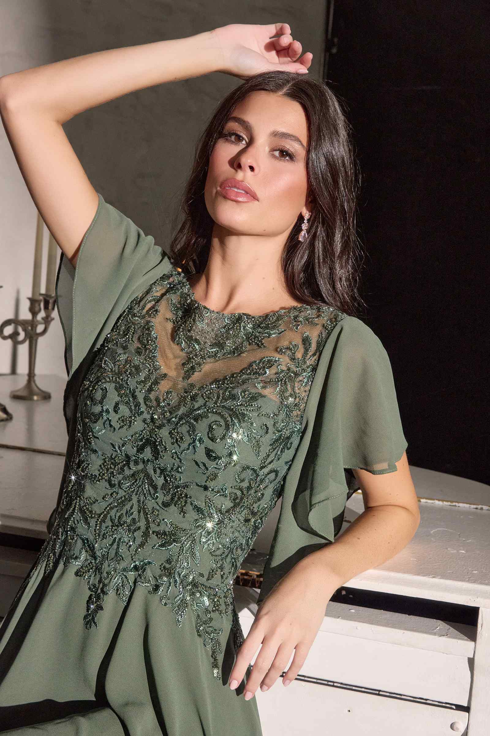 Olive green chiffon gown with flutter sleeves and sequined illusion neckline