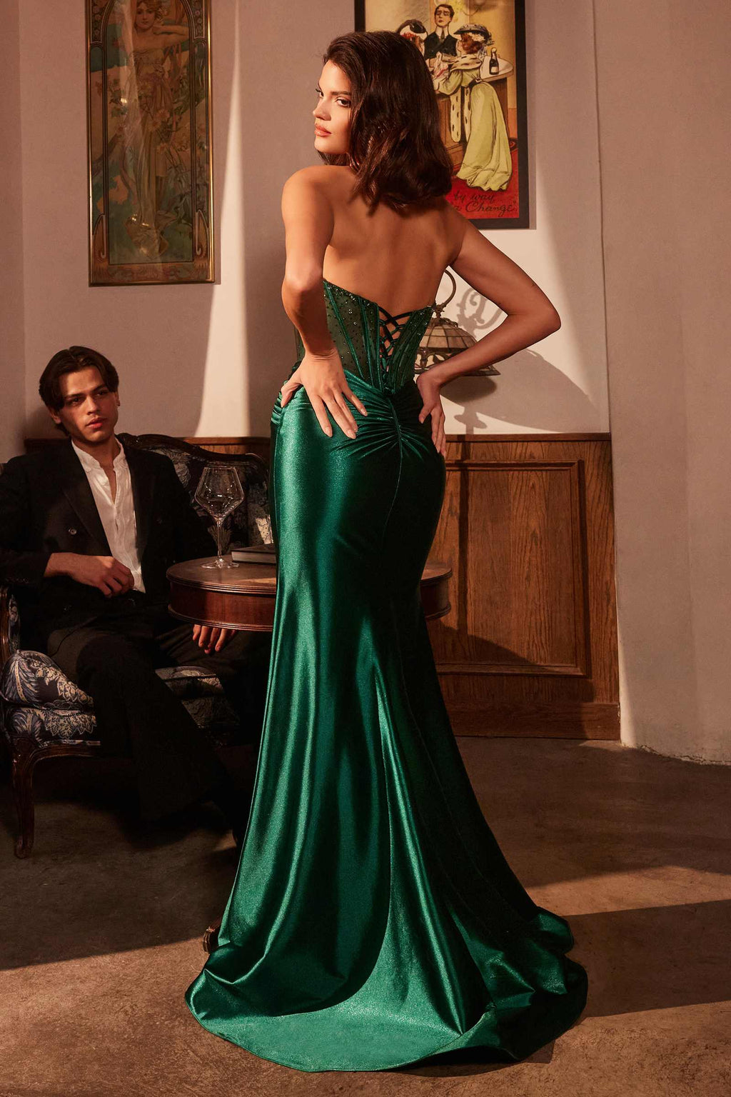 Emerald green strapless corset prom gown with lace-up open back and long side slit