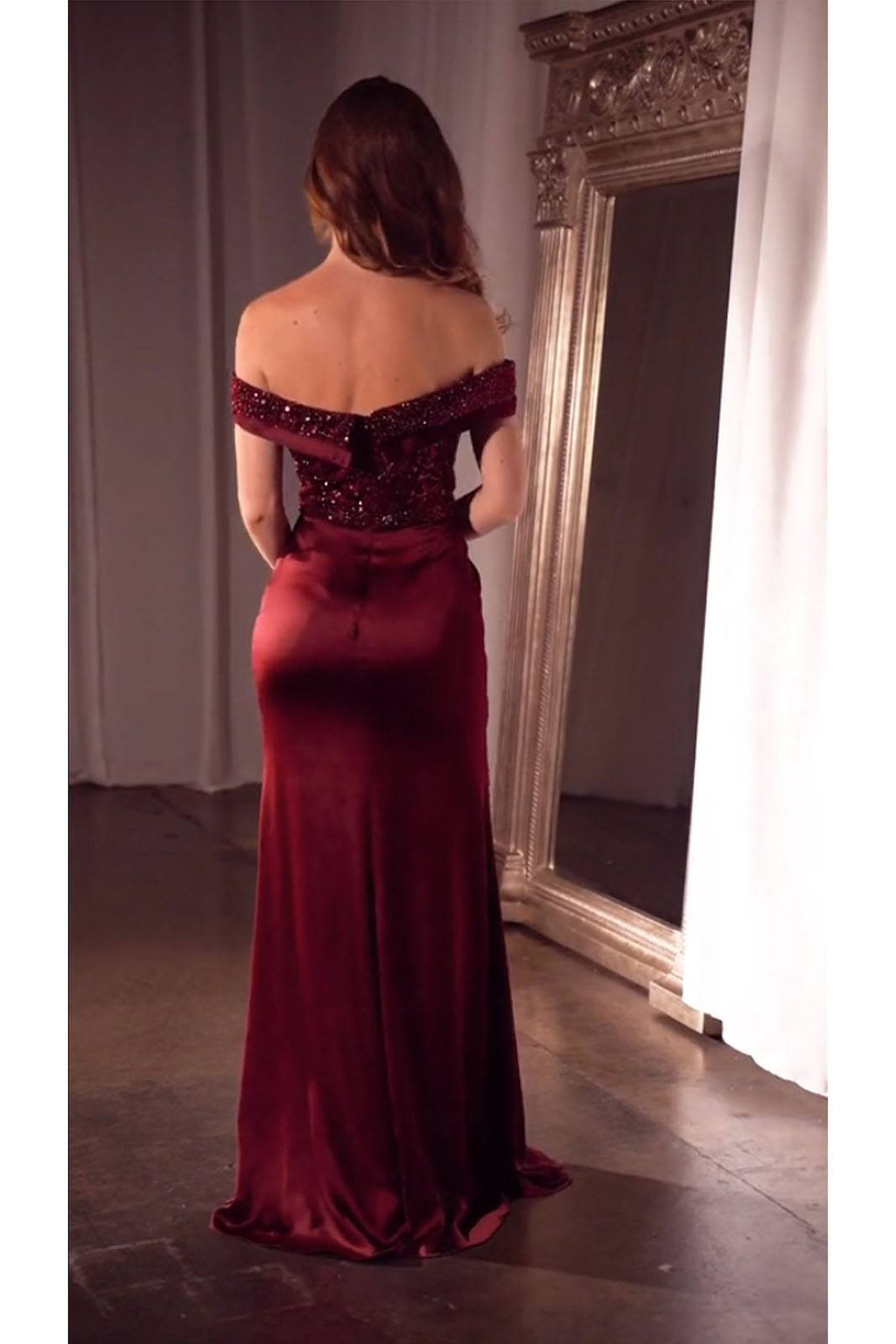Back view off-shoulder burgundy sequin bodice formal gown with satin drape
