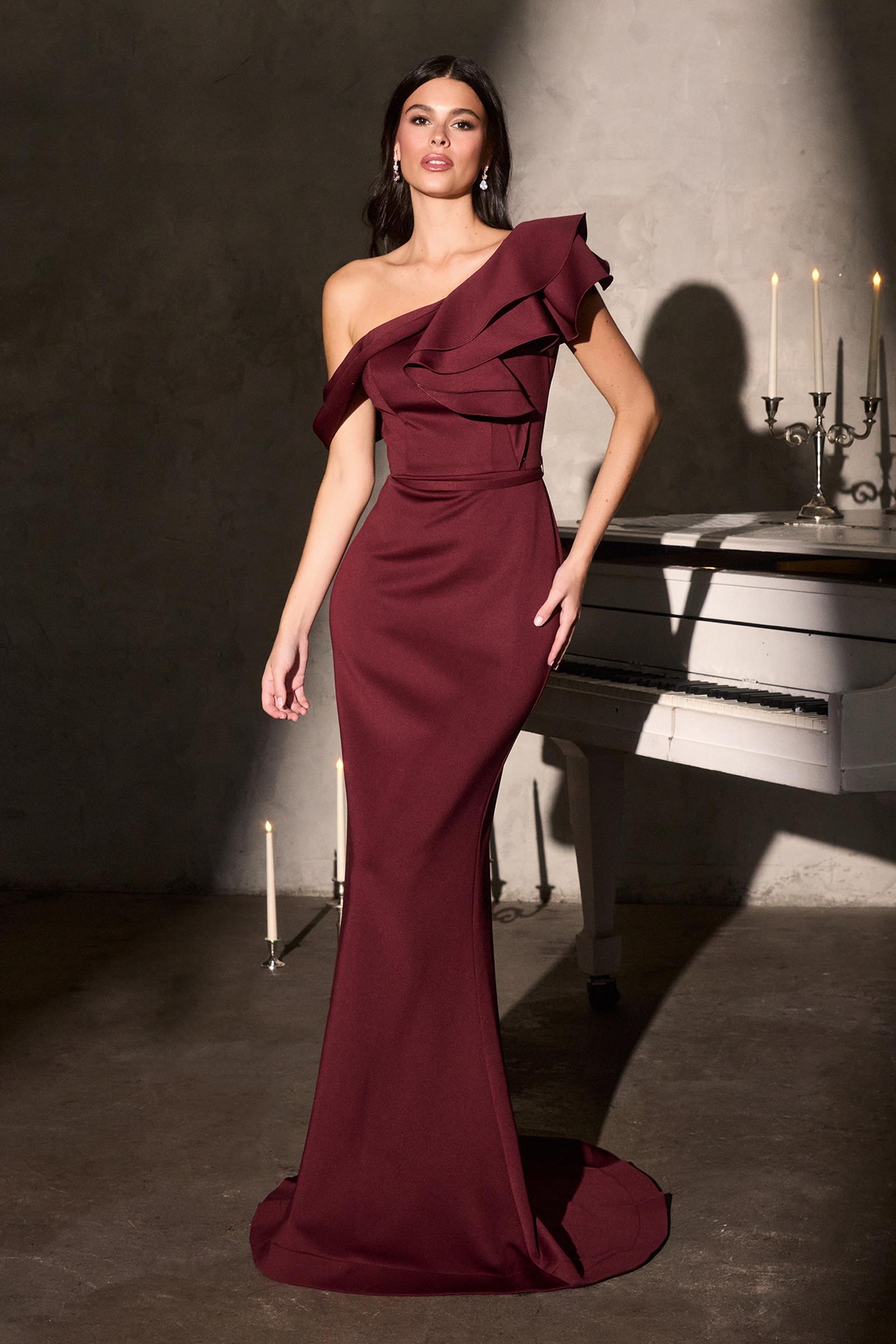 Burgundy one-shoulder mermaid evening gown with cascading ruffle accent
