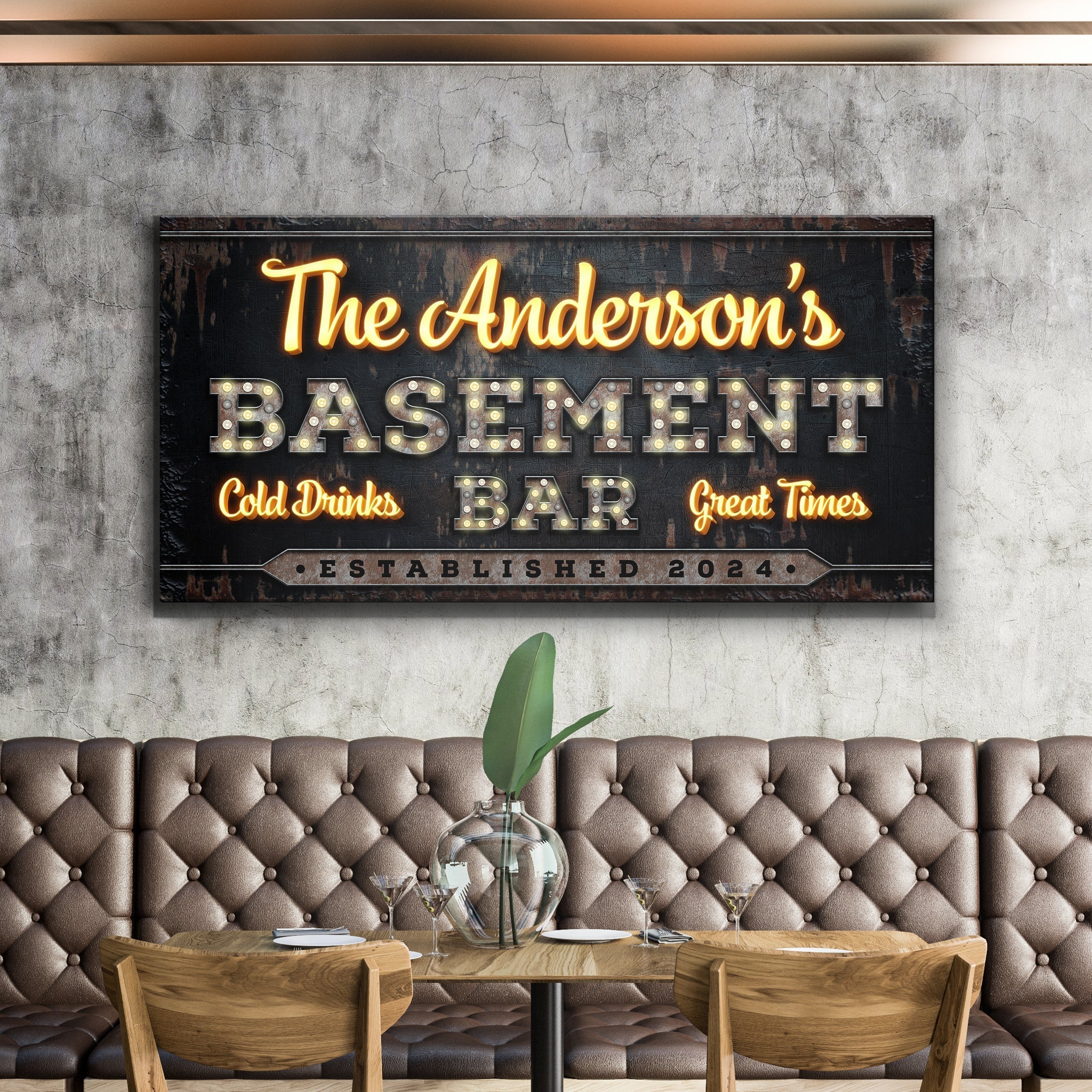 Vintage bar sign reading “The Anderson’s Basement Bar” above a tufted bench