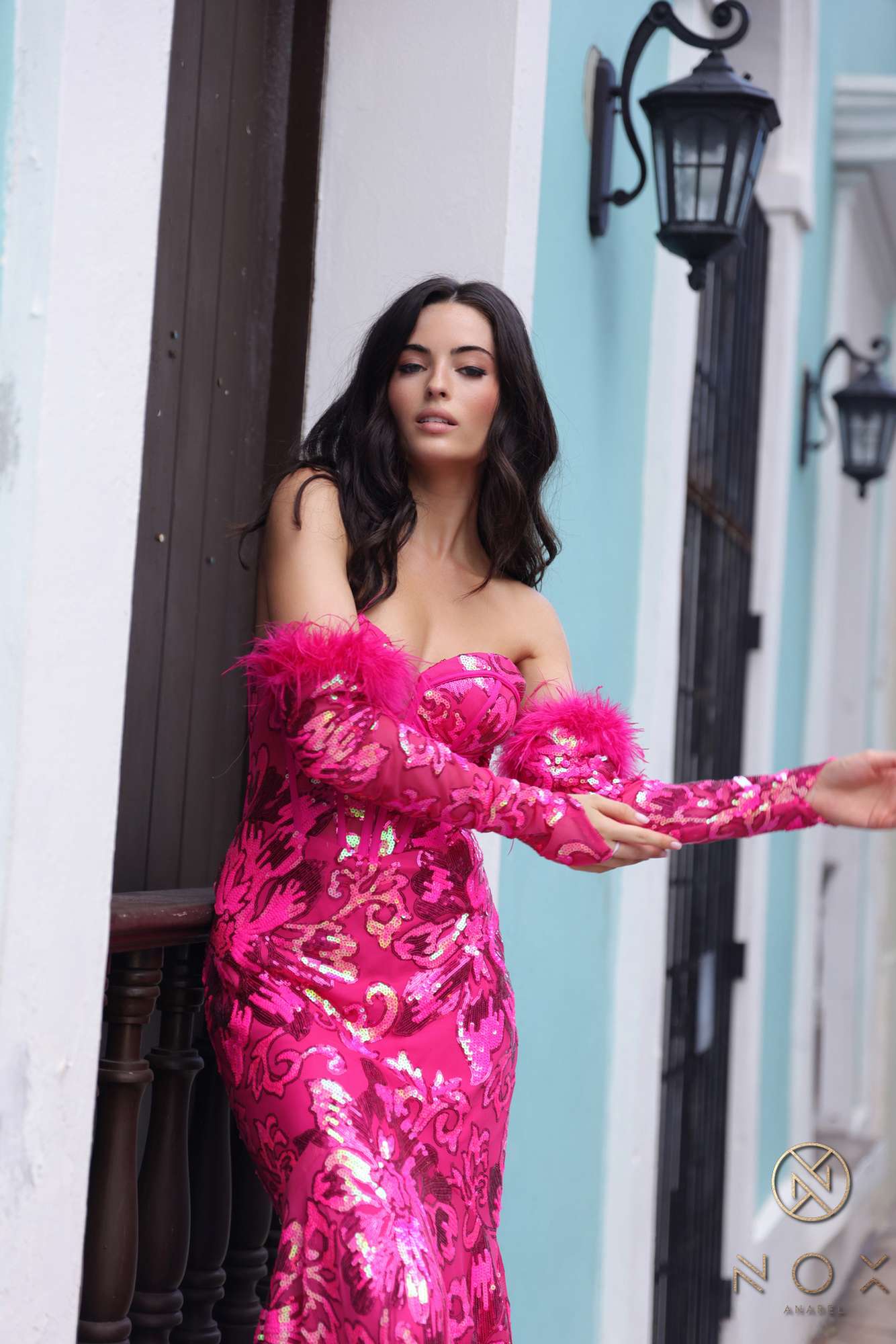 Fuchsia sequin mermaid gown with floral embroidery and off-shoulder detachable feather sleeves
