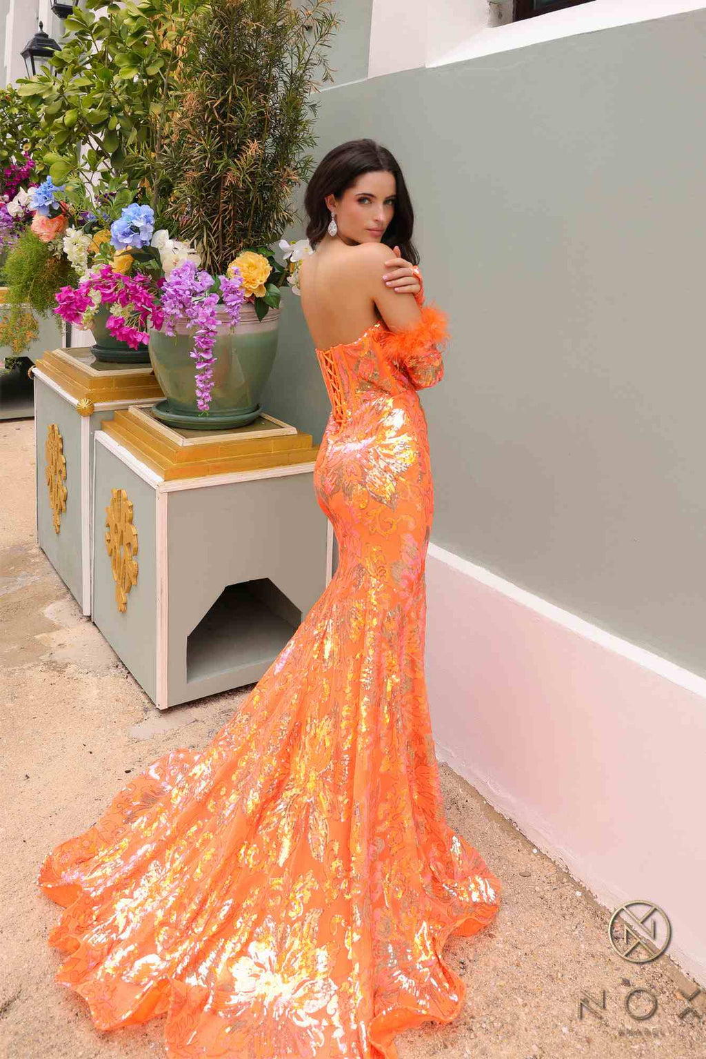 Orange floral sequin mermaid gown with detachable long sleeves and feather trim