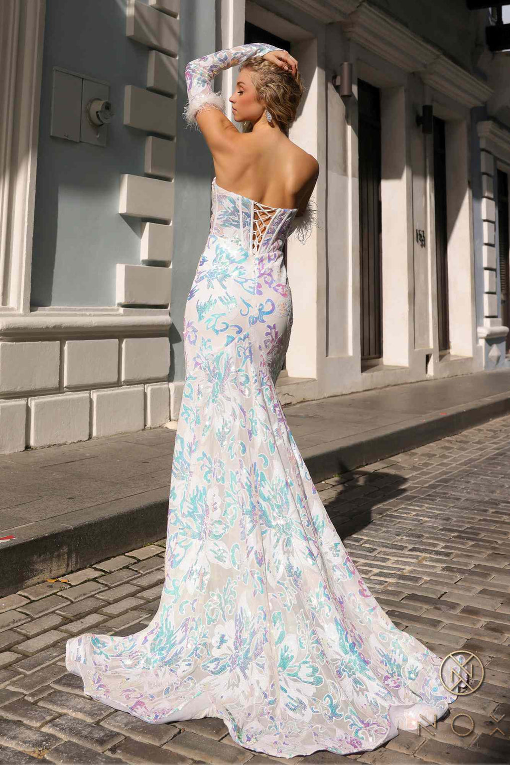 White multi floral sequin mermaid gown with detachable long sleeves and flowing flared mermaid hem