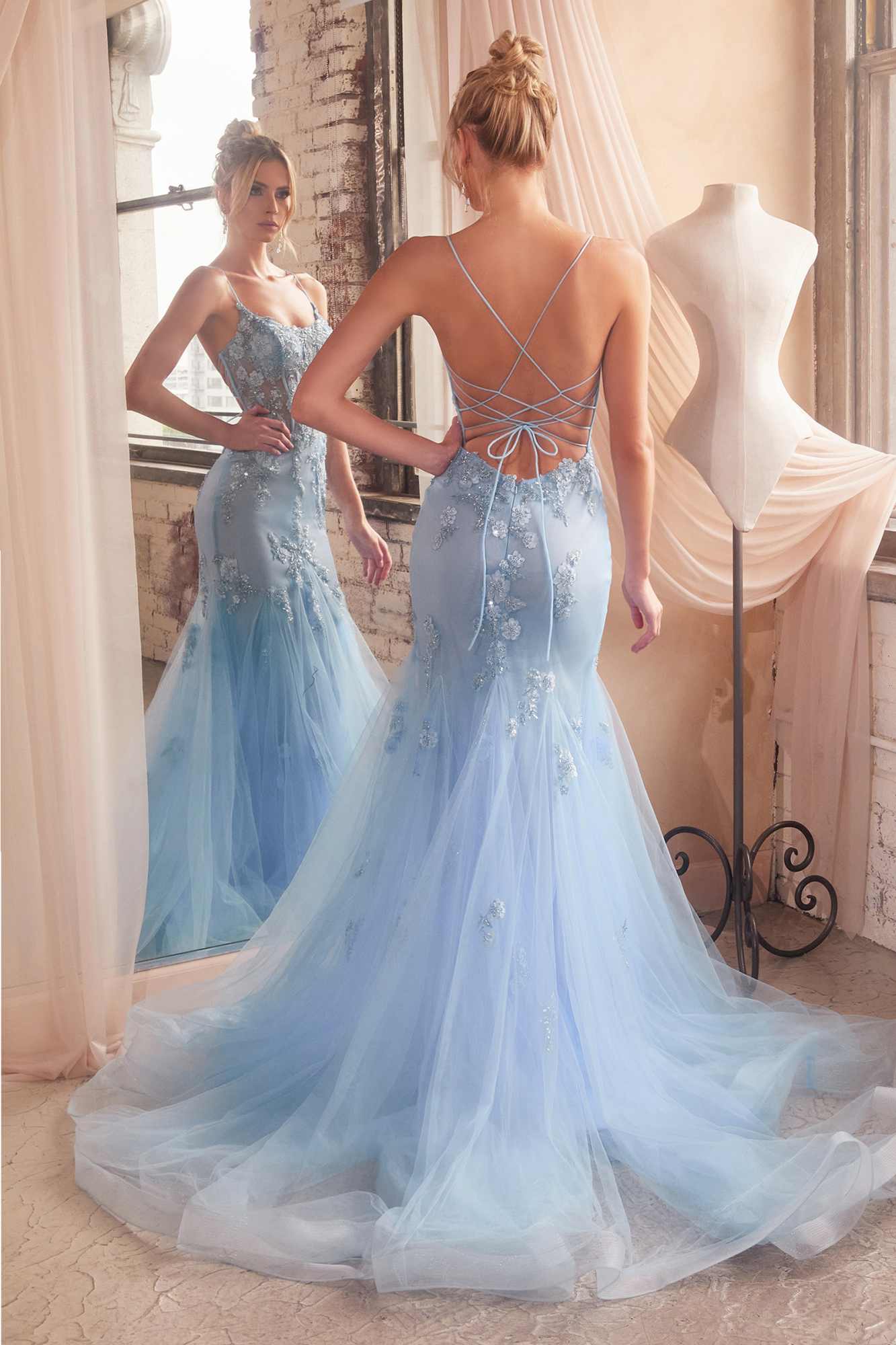 Light blue corset-back mermaid gown with floral appliqué and tulle skirt