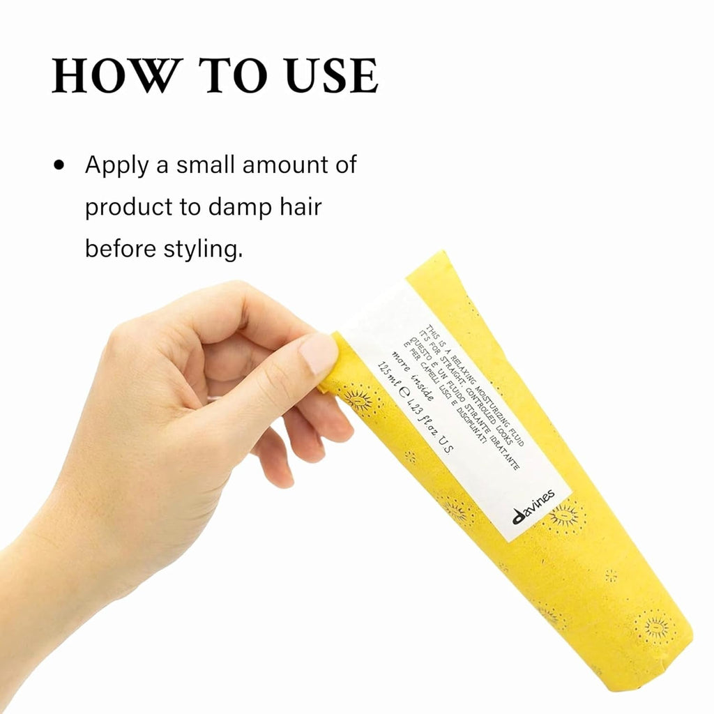 Davines More Inside relaxing moisturizing fluid tube, yellow label held in hand