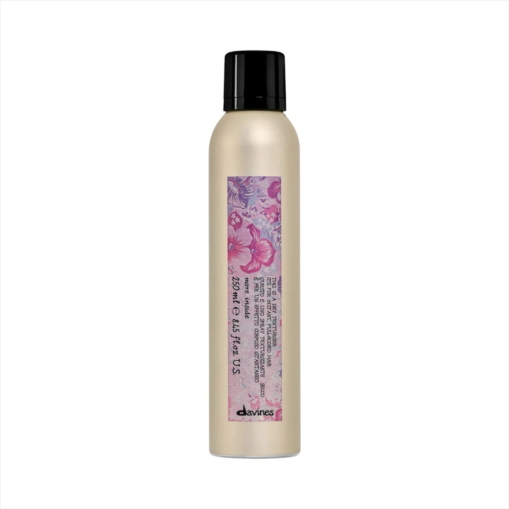 Davines dry texturizing finishing spray bottle, beige bottle with black cap