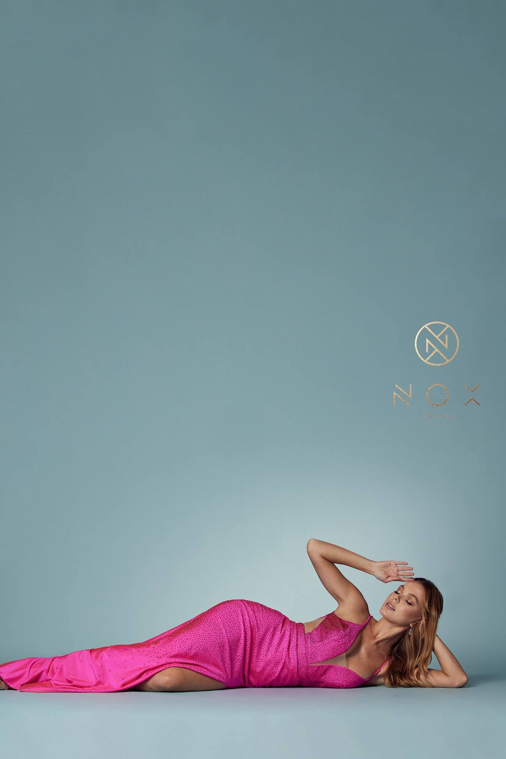 Fuchsia beaded mermaid gown with plunging neckline and front slit