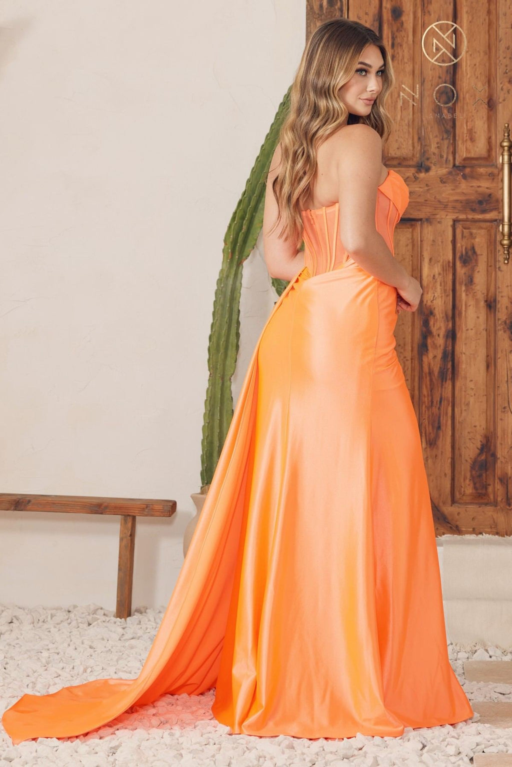 Orange satin strapless cowl-neck floor-length gown with gathered waist and side slit