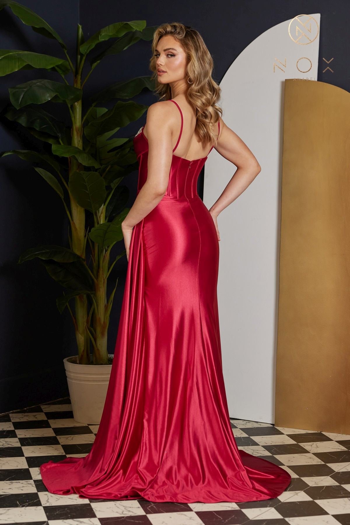 Red satin fitted gown with thin straps and side slit, floor length