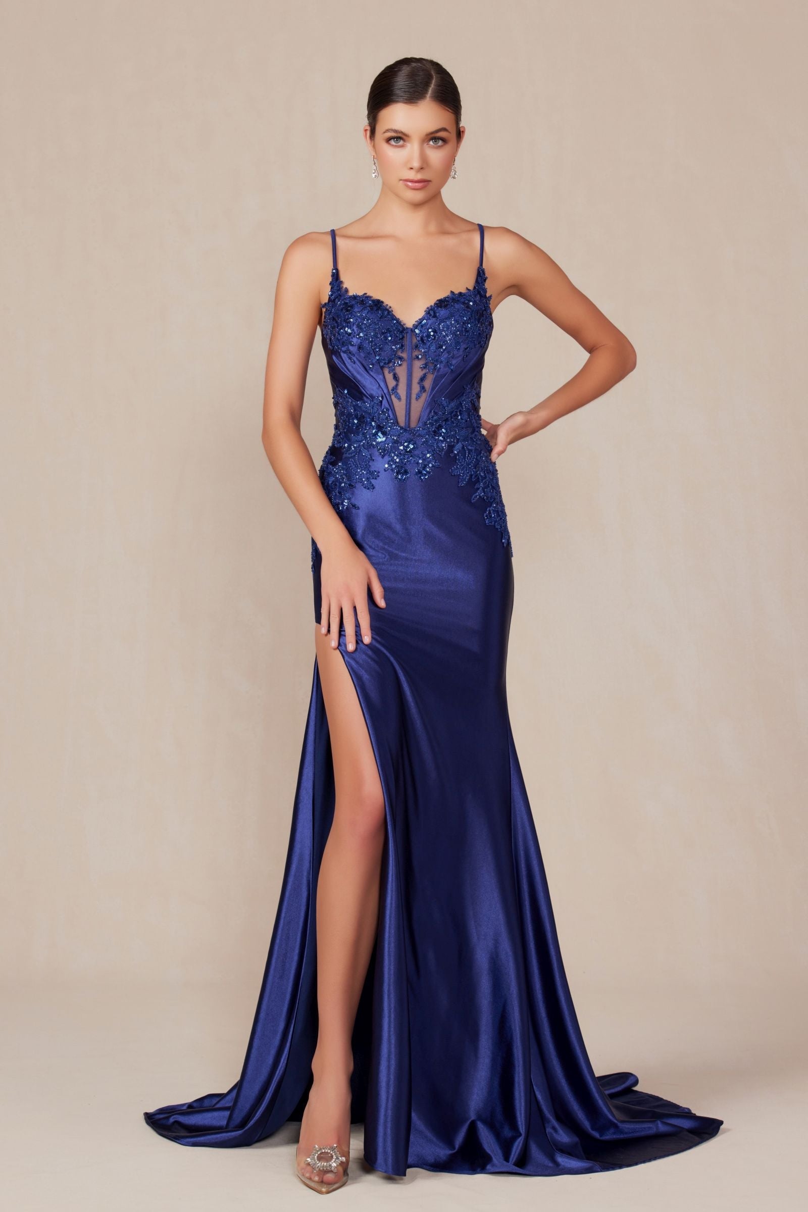 Navy satin evening dress with sweetheart neckline, jeweled bodice, and front slit