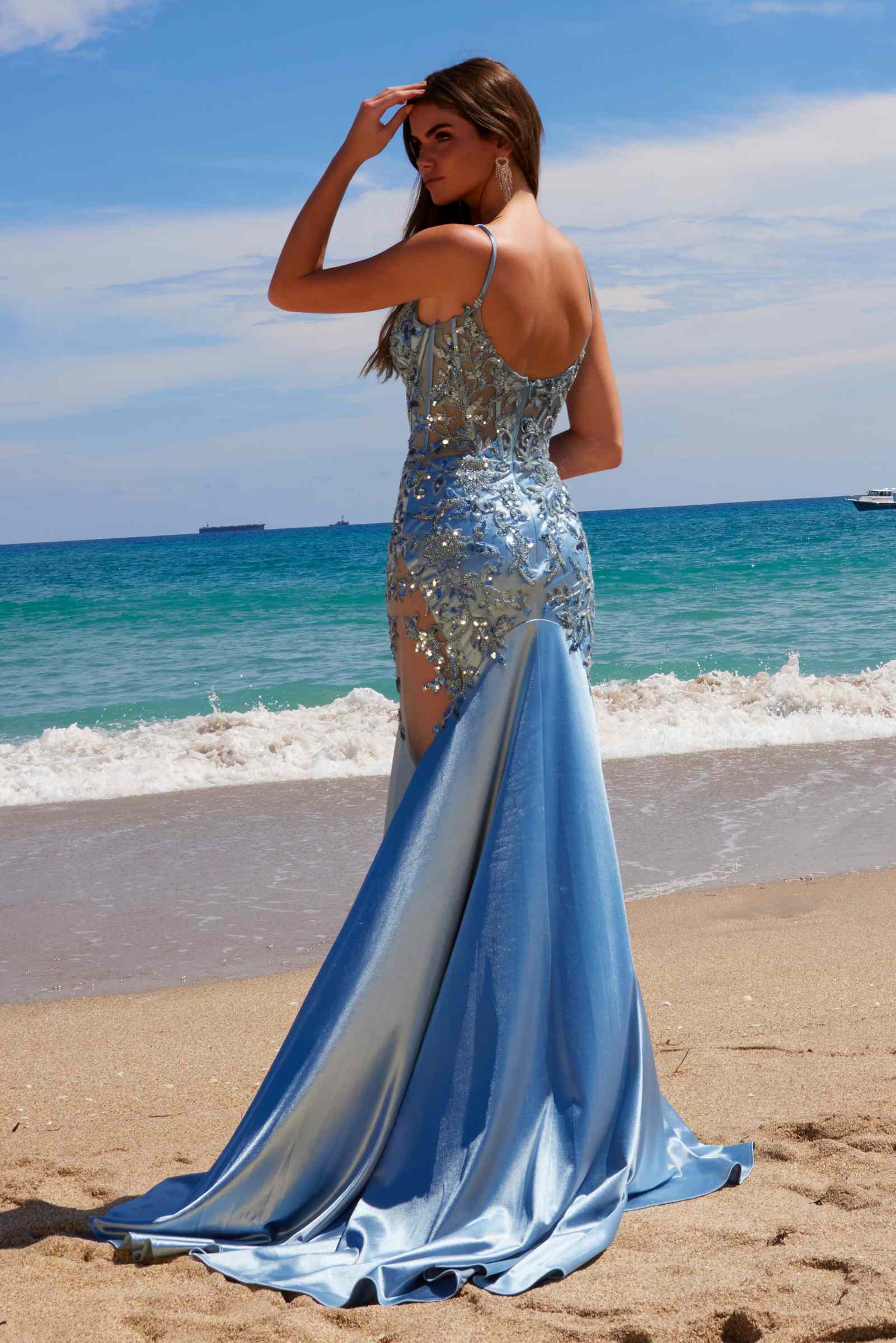 Dusty blue mermaid evening dress with thin straps and ornate silver sequin detailing