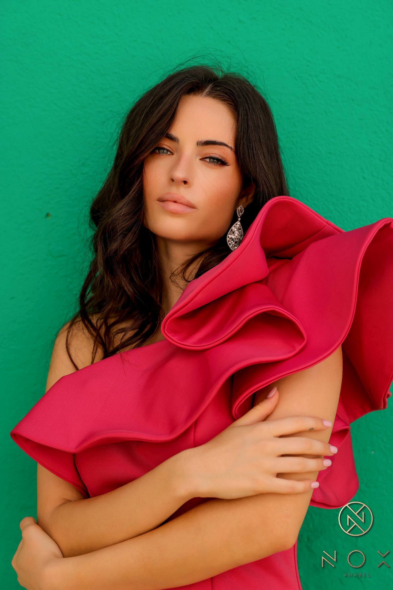One-shoulder ruffle overlay sheath gown, close-up of red ruffle neckline.
