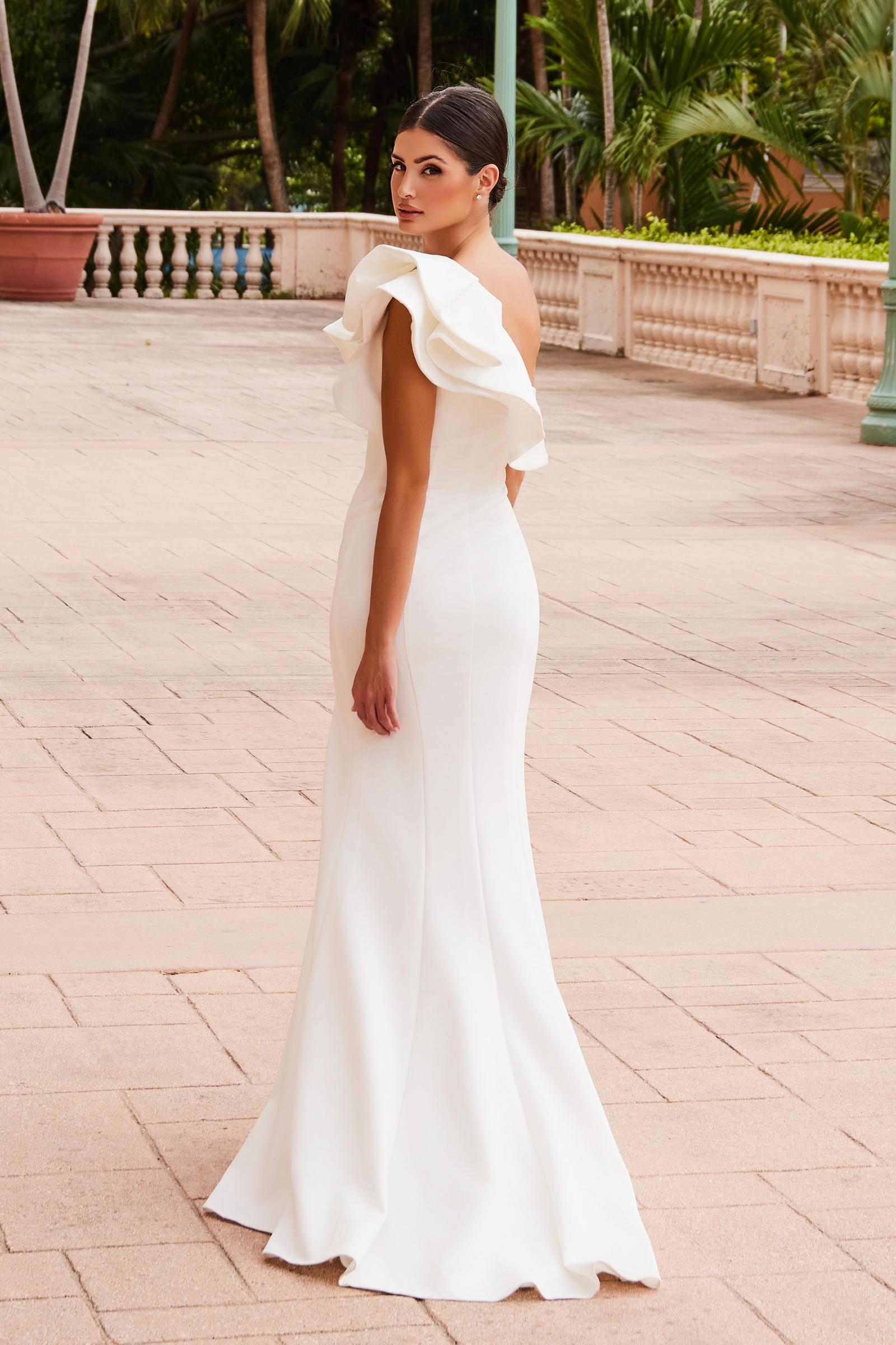 White one-shoulder ruffle sheath gown, fitted bodice, long skirt with side slit