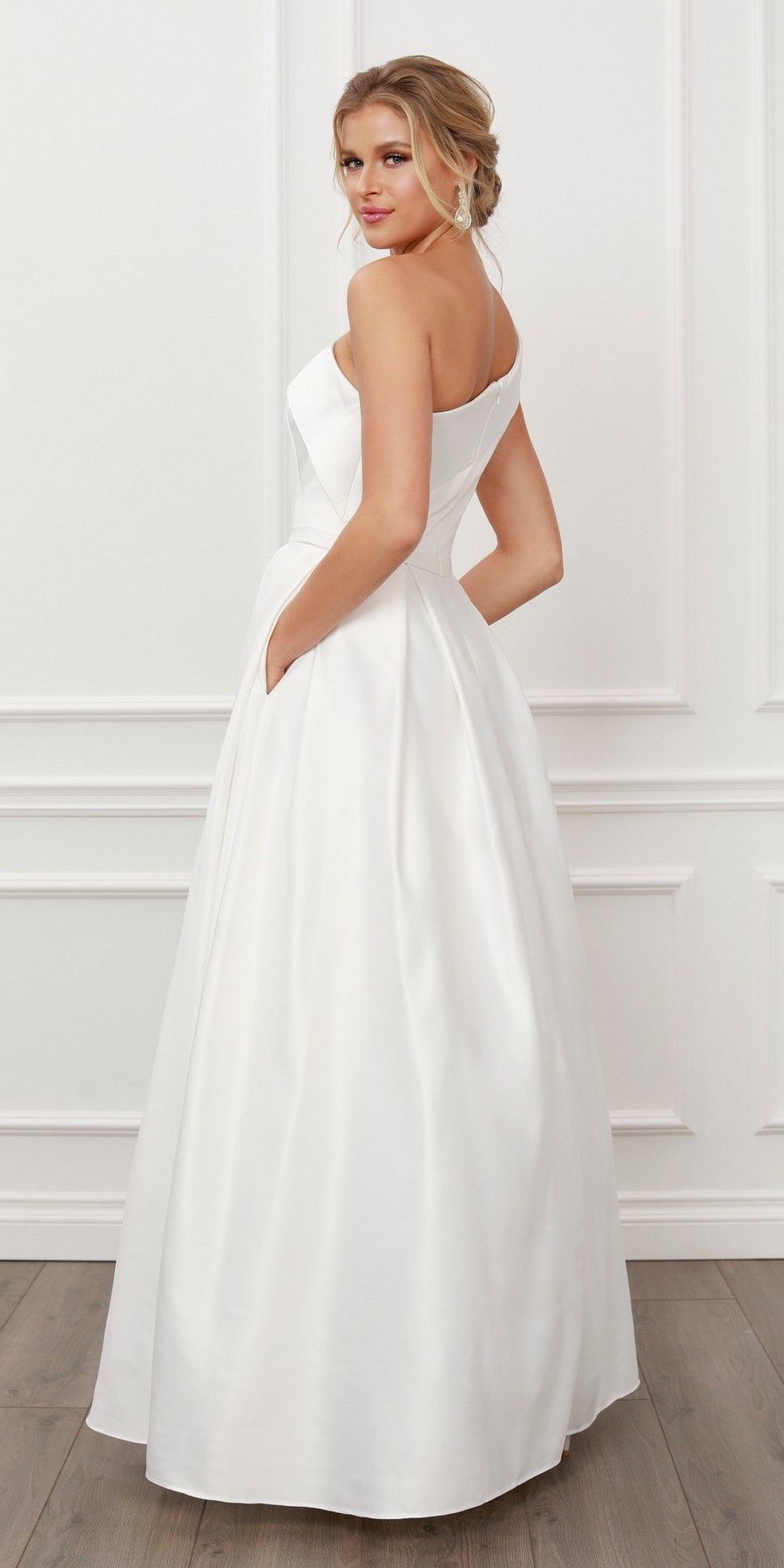 White one-shoulder satin A-line long dress, back 3/4 view with off-shoulder neckline