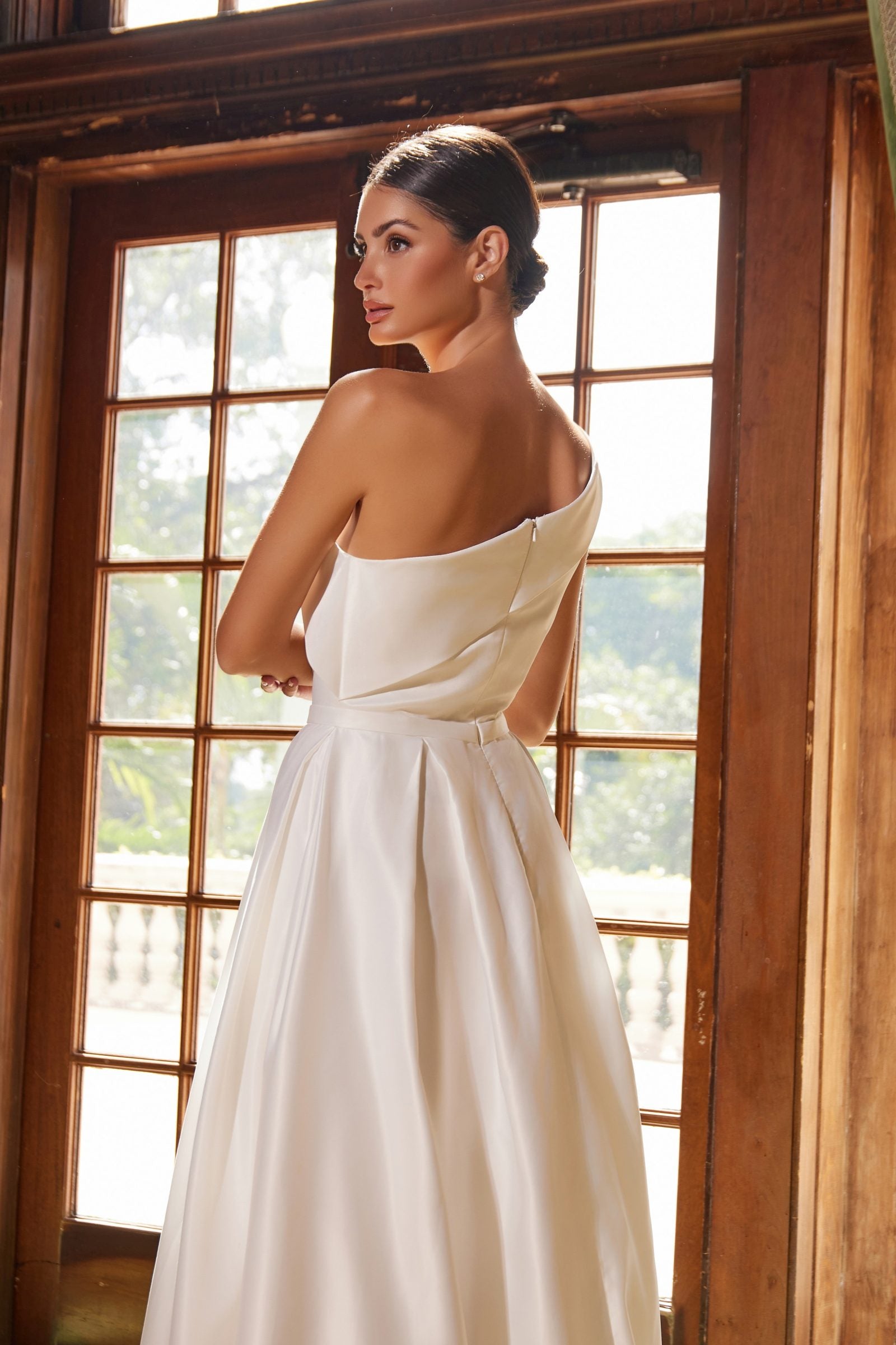 White one-shoulder satin A-line long dress, close side view with diagonal neckline