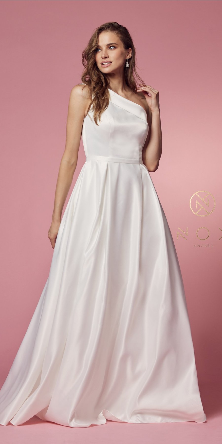 White one-shoulder satin A-line long dress on model, fitted bodice and flowing skirt