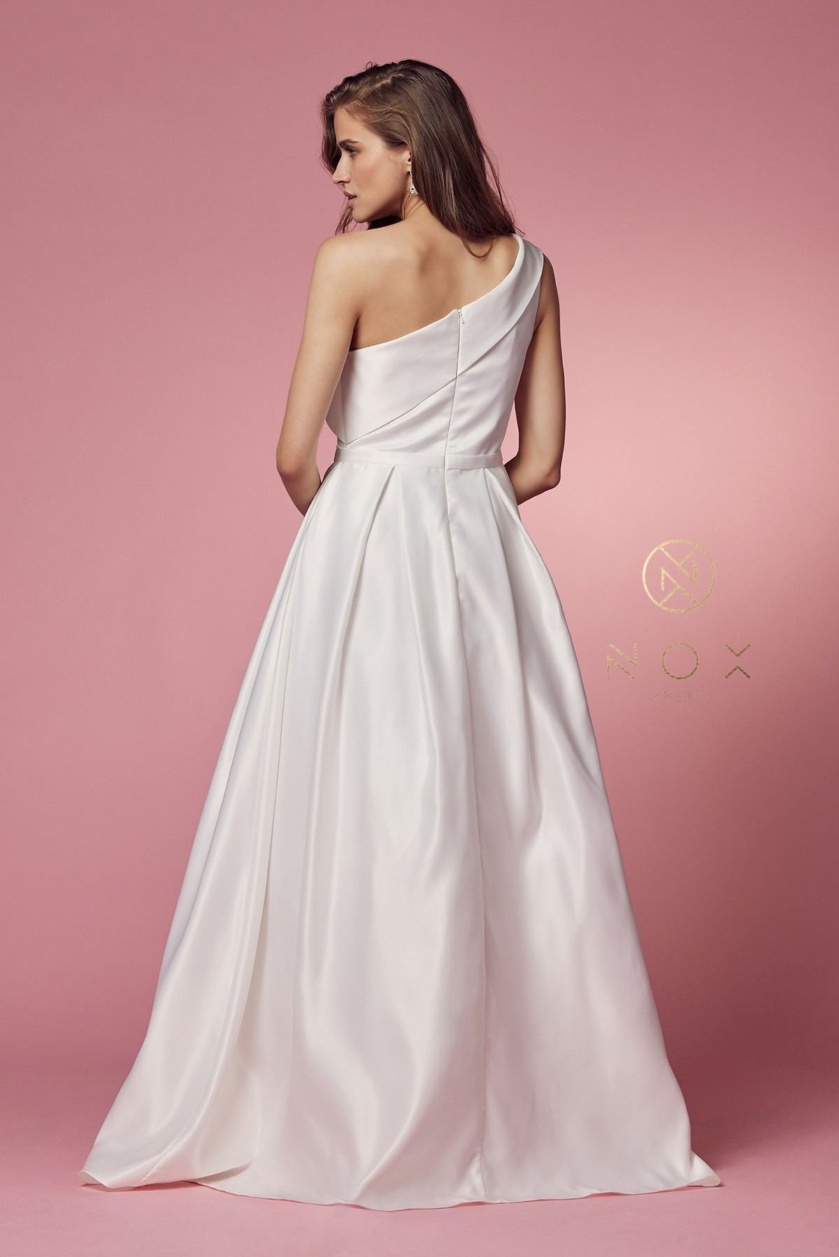 White one-shoulder satin A-line long dress, back view with diagonal strap styling