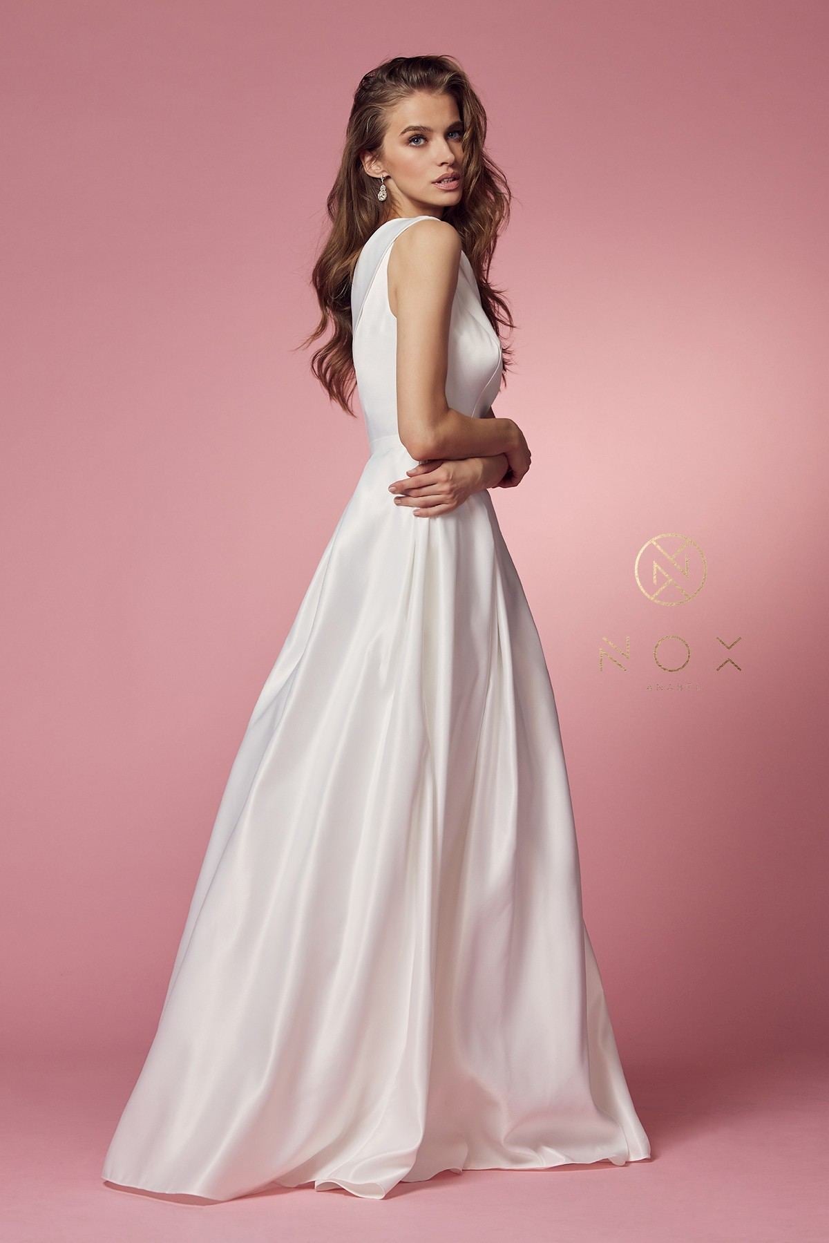 White one-shoulder satin A-line long dress, 3/4 side view with full flared hem