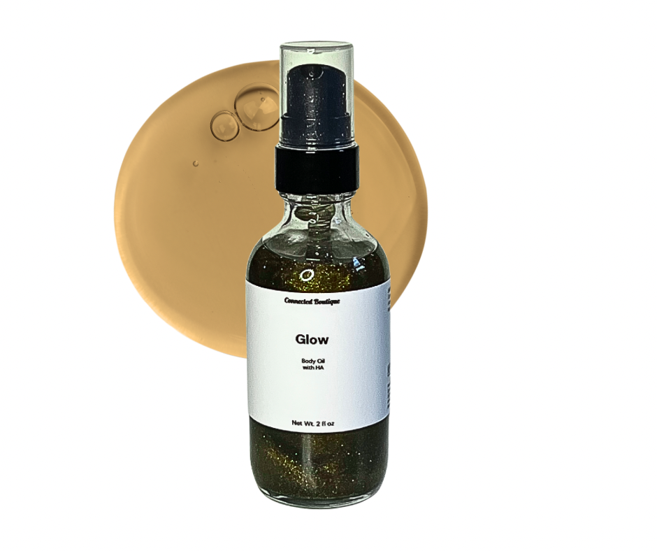 Glow body oil spray bottle, clear glass with black pump, dark green oil liquid