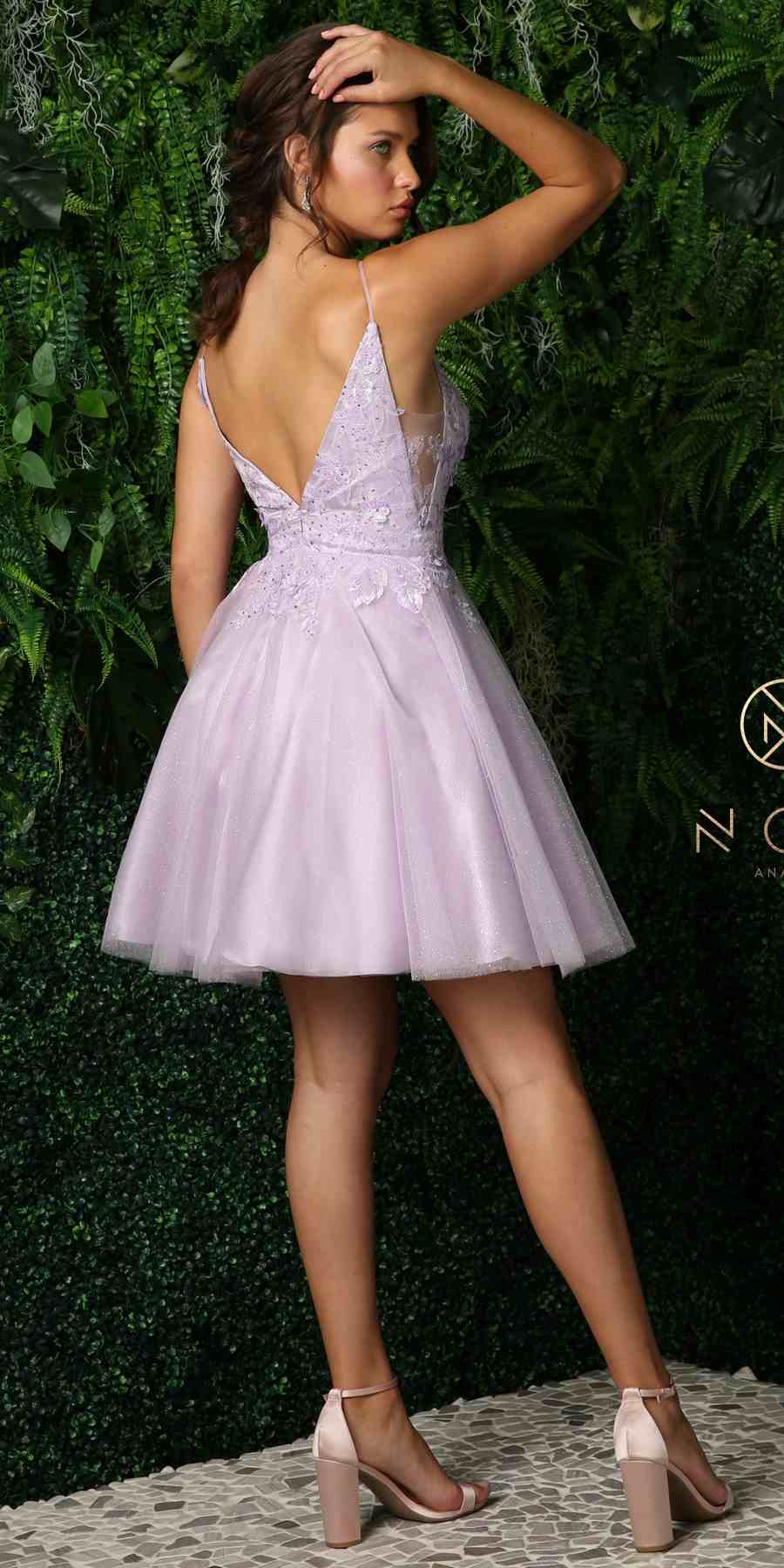 Dusty lilac plunging V-neck dress with embroidered bodice and flared skirt.