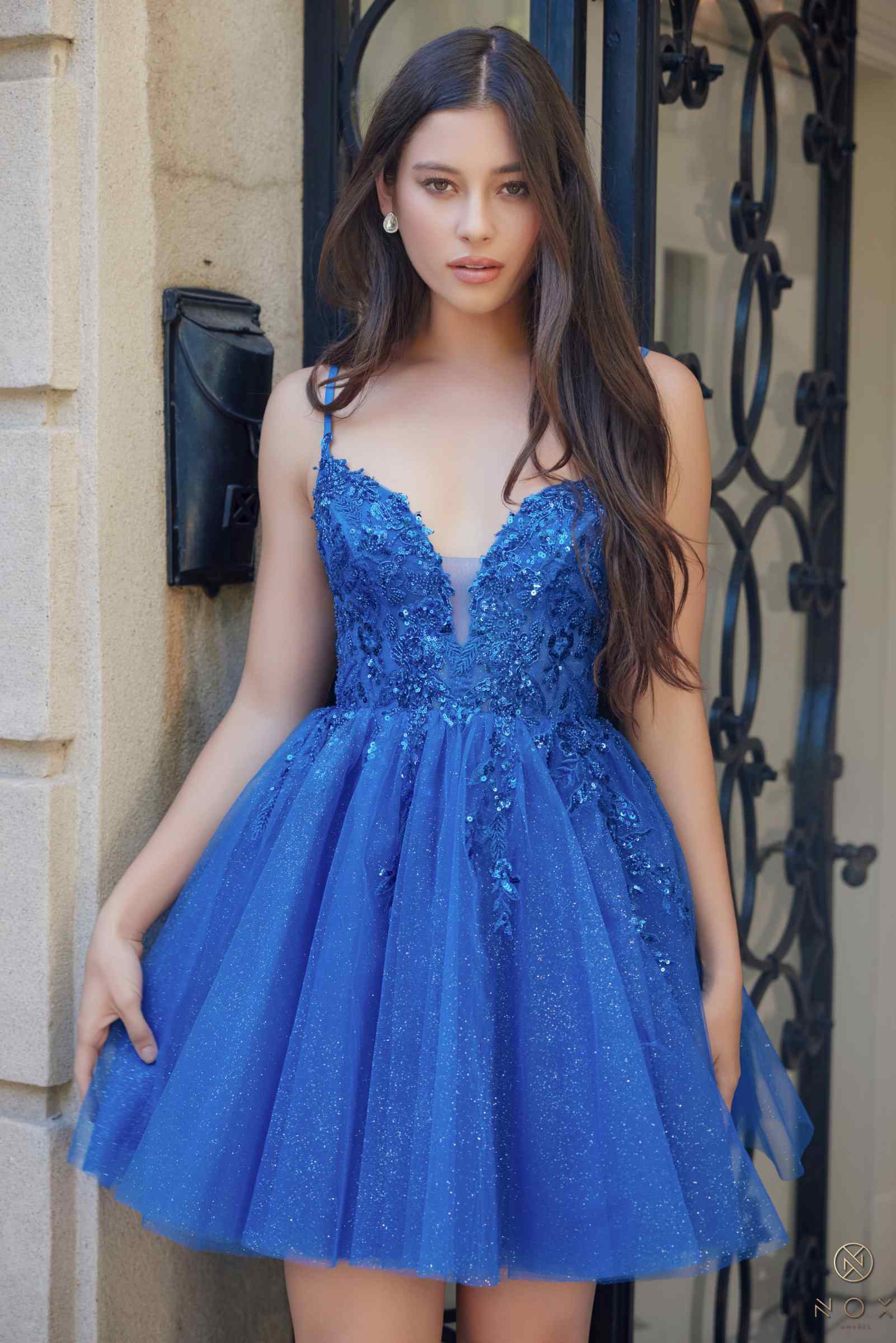 Royal blue sleeveless A-line dress with V-neck and glitter applique bodice
