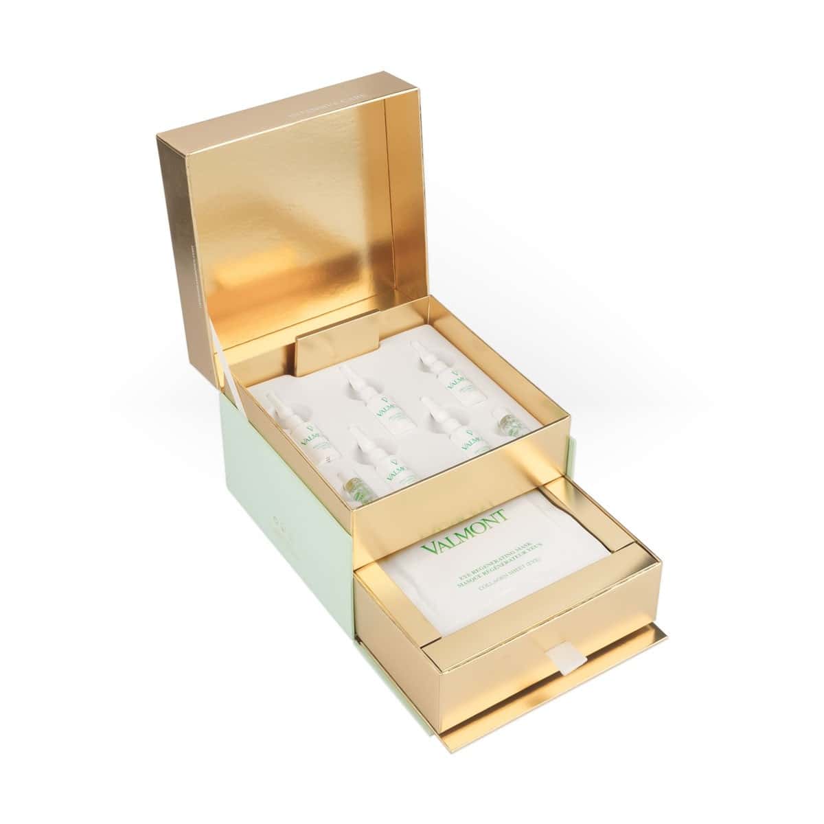 Eye regenerating mask treatment set in open gold display box with sachets and booklet