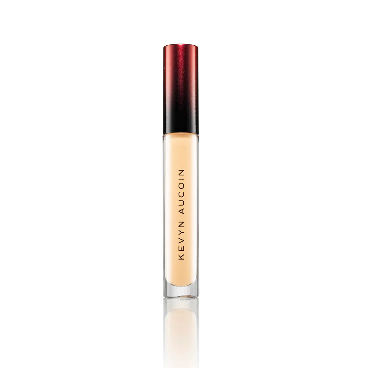 Kevyn Aucoin concealer in light beige tube with red-black cap and clear applicator base