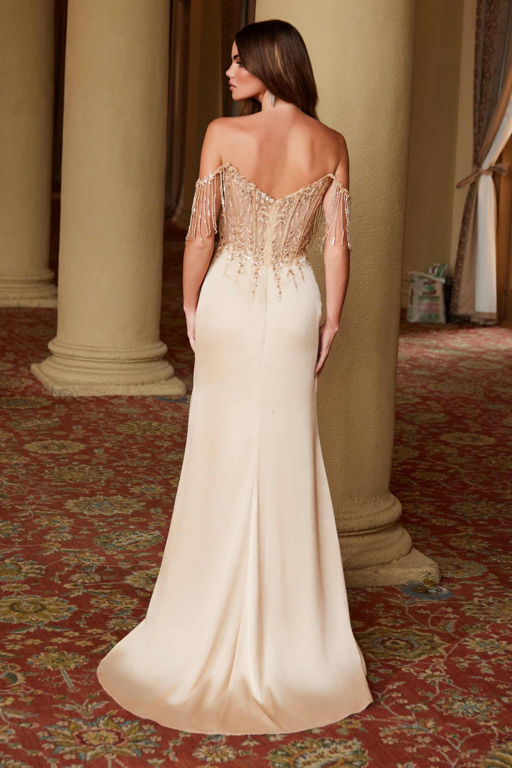 Champagne off-shoulder sequin gown, open back with fringed shoulder details