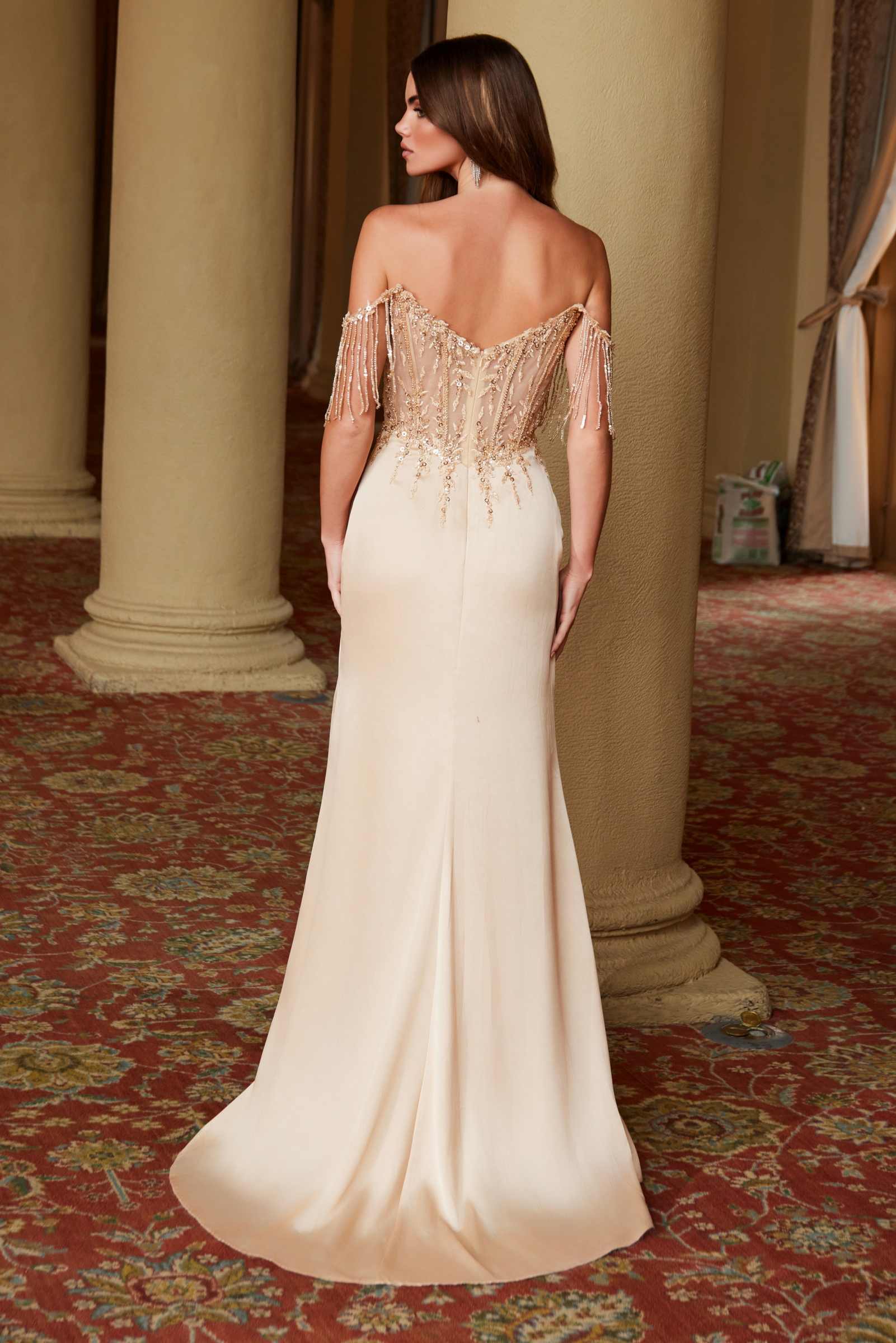 Champagne off-shoulder sequin gown, open back with fringed shoulder details