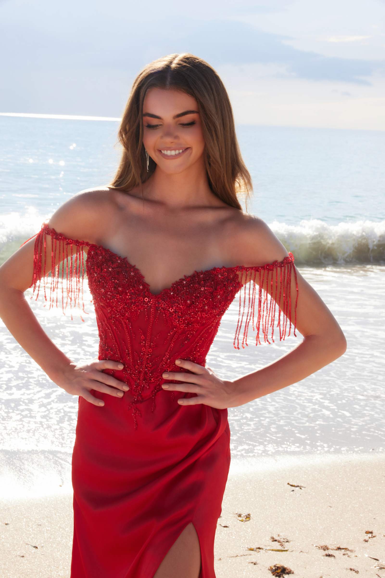 Red sequin off-shoulder sweetheart dress with fringe sleeves and thigh slit