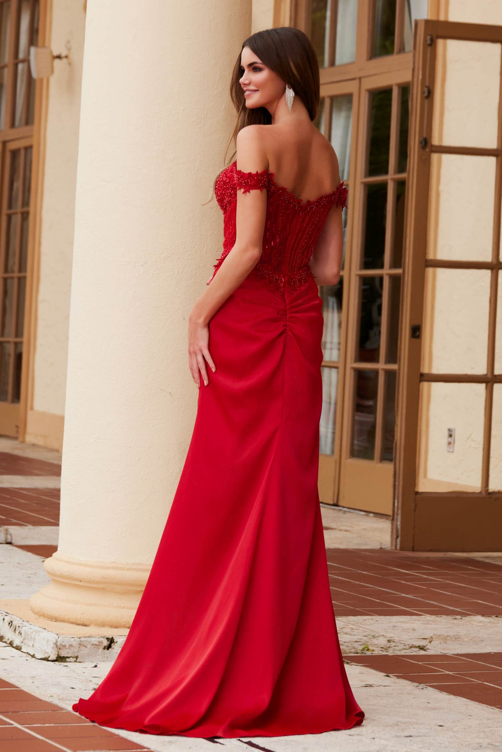 Red sequin off-shoulder evening gown with open back and thigh slit