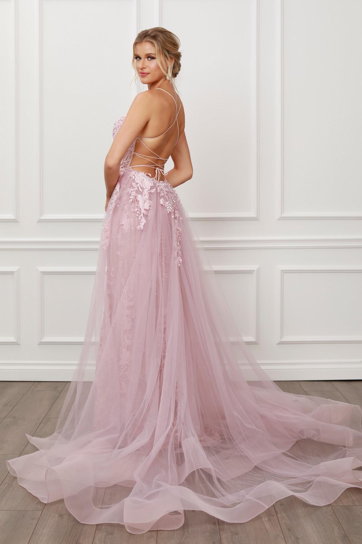 Blush mermaid lace gown with beaded bodice and sheer tulle overskirt, angled back view
