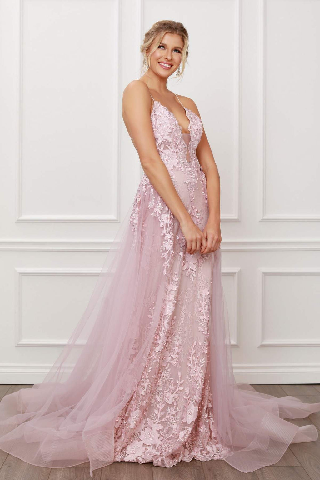 Blush mermaid gown with lace-applique beading, V-neck bodice, and sheer chiffon overskirt