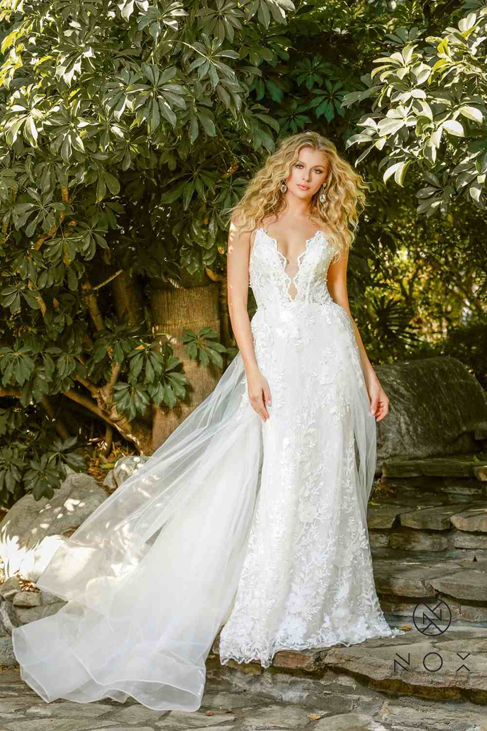 Ivory mermaid gown with lace applique and beaded V-neck bodice with long tulle train