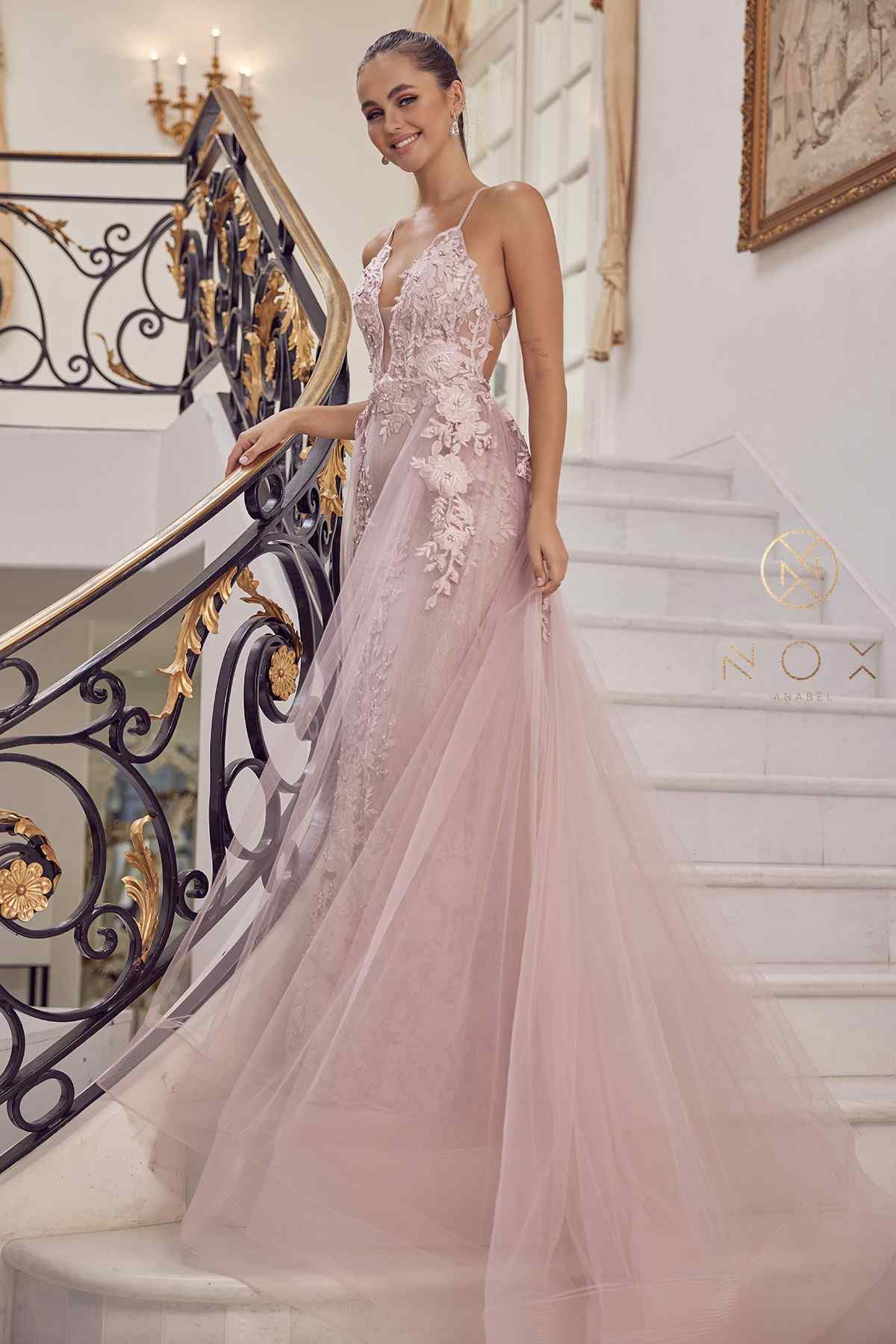 Blush mermaid lace gown with beaded bodice and sheer tulle overskirt, front side view